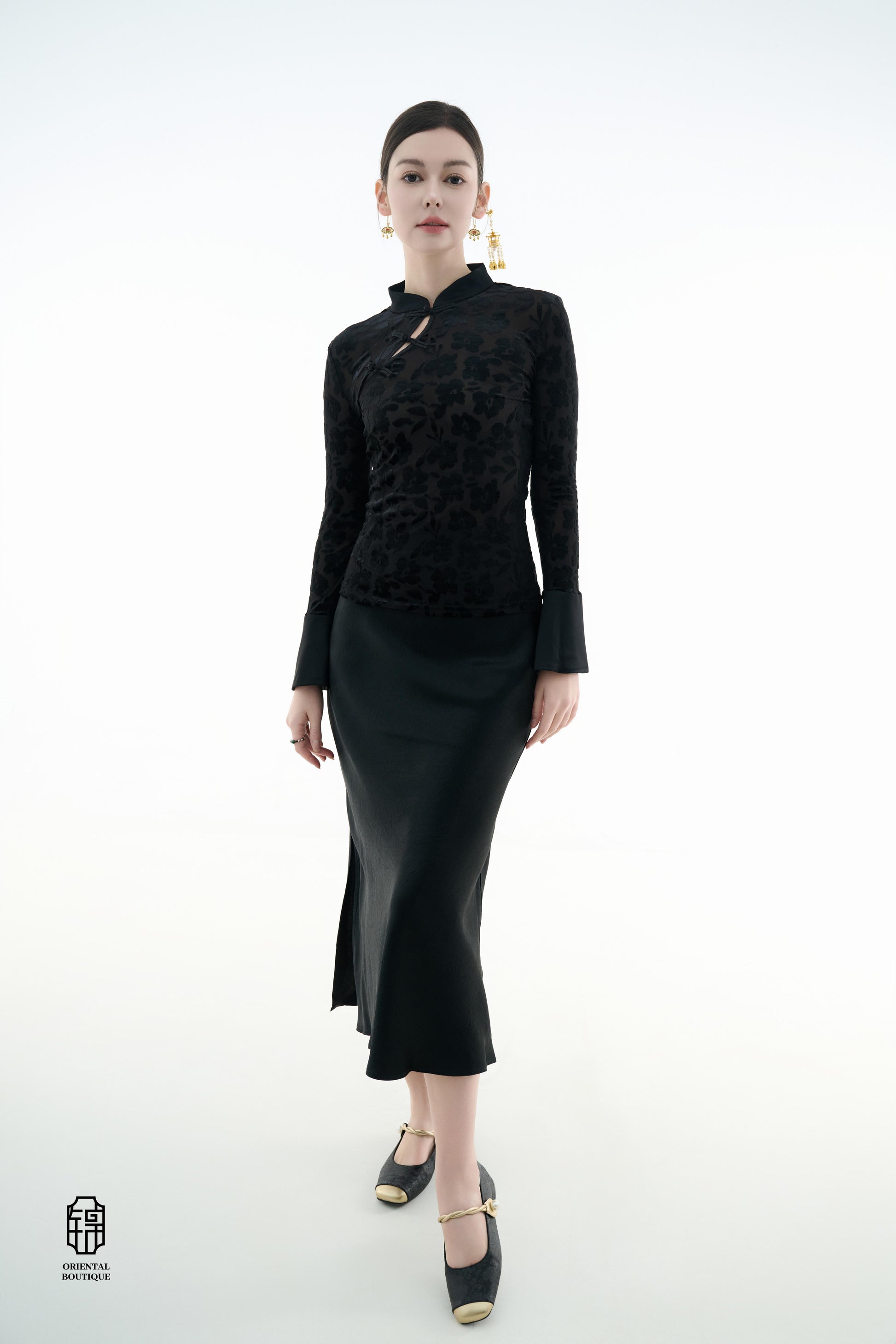 Ink Floral Silhouette Blouse,The Ink Floral Silhouette Blouse is an elegant top that combines traditional Eastern aesthetics with modern fashion elements, featuring a deep black base color. The fabric showcases a subtle floral jacquard pattern that shimme
