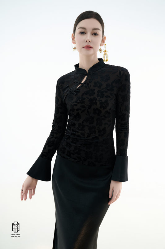 Ink Floral Silhouette Blouse,The Ink Floral Silhouette Blouse is an elegant top that combines traditional Eastern aesthetics with modern fashion elements, featuring a deep black base color. The fabric showcases a subtle floral jacquard pattern that shimme