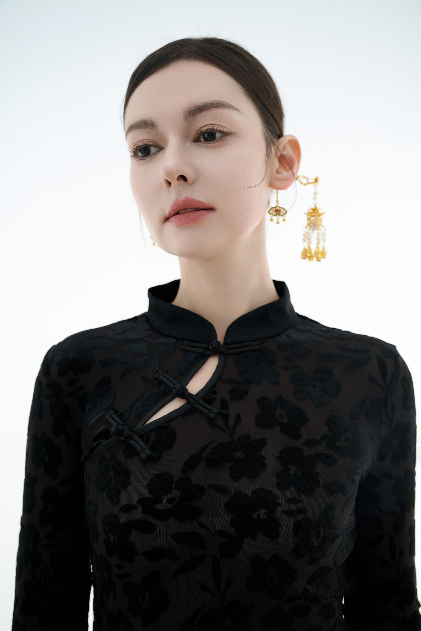 Ink Floral Silhouette Blouse,The Ink Floral Silhouette Blouse is an elegant top that combines traditional Eastern aesthetics with modern fashion elements, featuring a deep black base color. The fabric showcases a subtle floral jacquard pattern that shimme