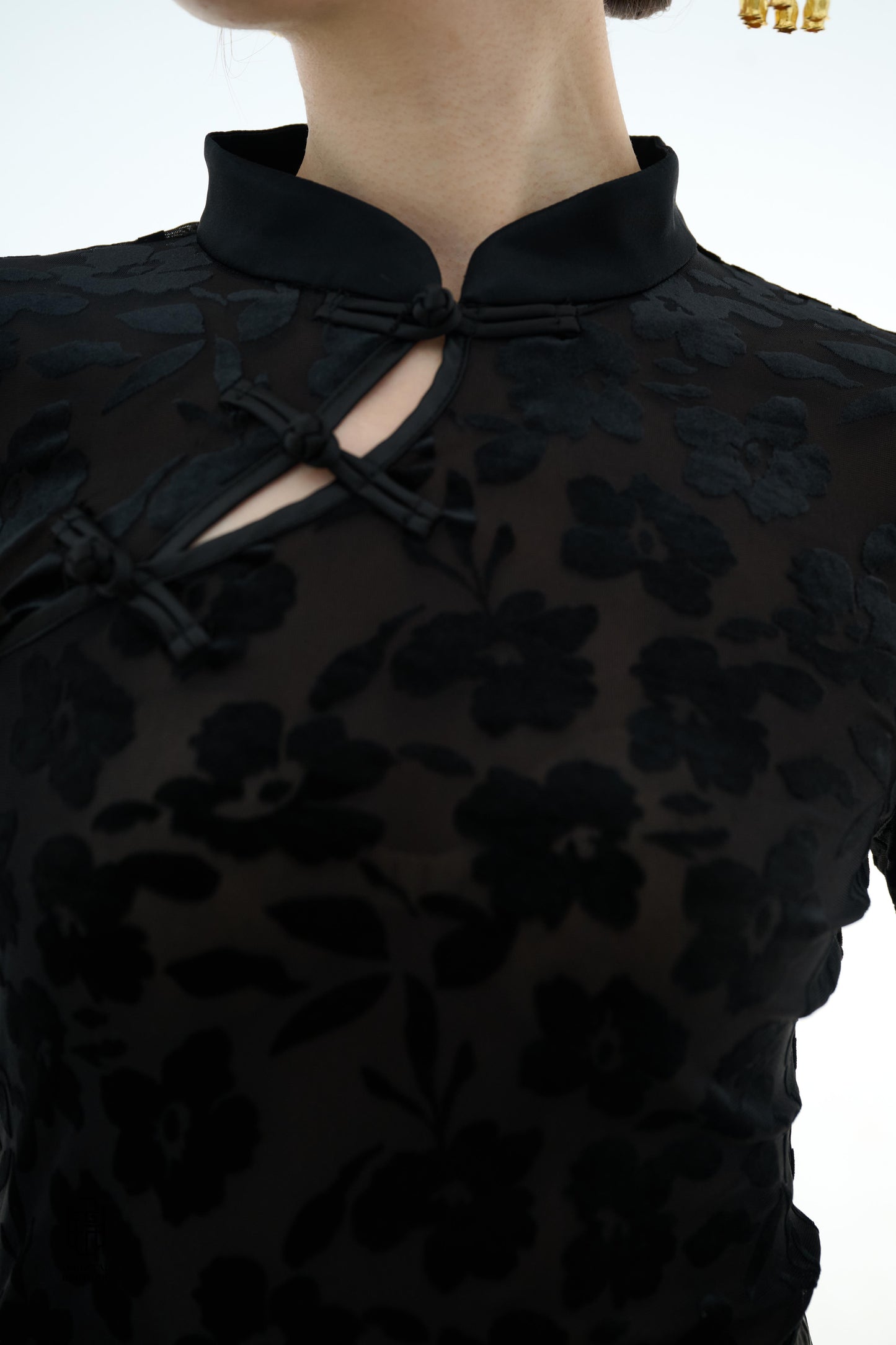 Ink Floral Silhouette Blouse,The Ink Floral Silhouette Blouse is an elegant top that combines traditional Eastern aesthetics with modern fashion elements, featuring a deep black base color. The fabric showcases a subtle floral jacquard pattern that shimme
