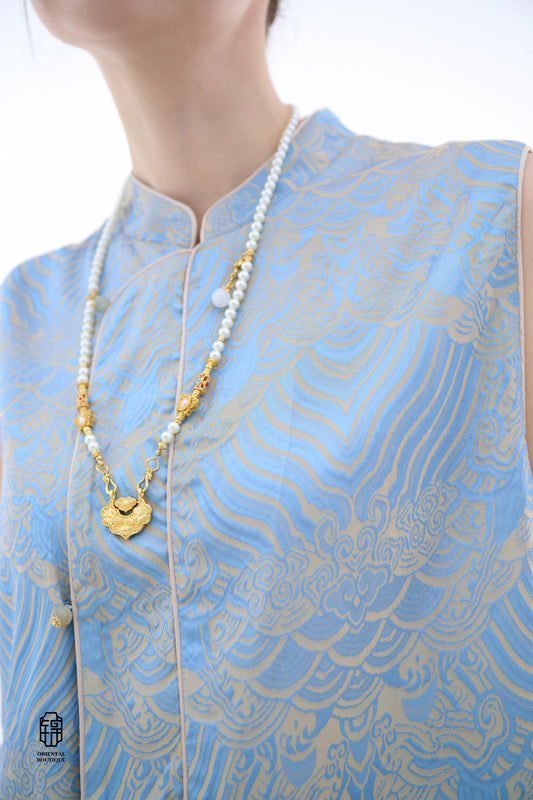 Blue Ocean Cloud Sleeveless Top,The Blue Ocean Cloud Sleeveless Top is crafted from a delicate light blue silk fabric, featuring intricate patterns of clouds and ocean waves, embodying the elegance and unique aesthetics of Eastern design. The sleeveless c