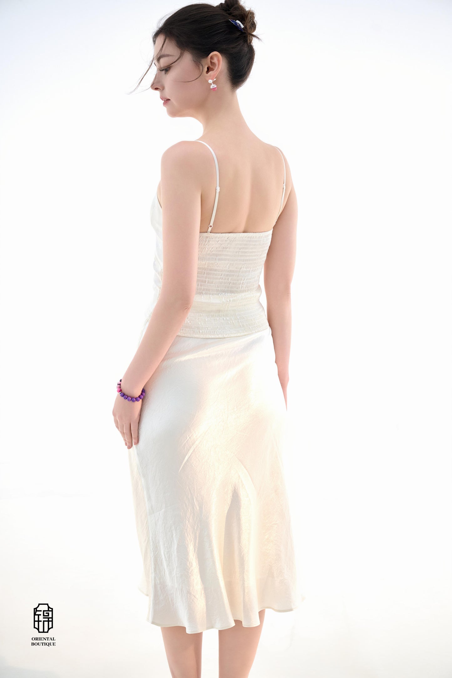 Midnight Silk Camisole,This lightweight camisole comes in classic black and elegant white, blending simplicity with a hint of allure. Crafted from airy silk fabric, it fits comfortably against the skin, beautifully highlighting the natural curves. The min