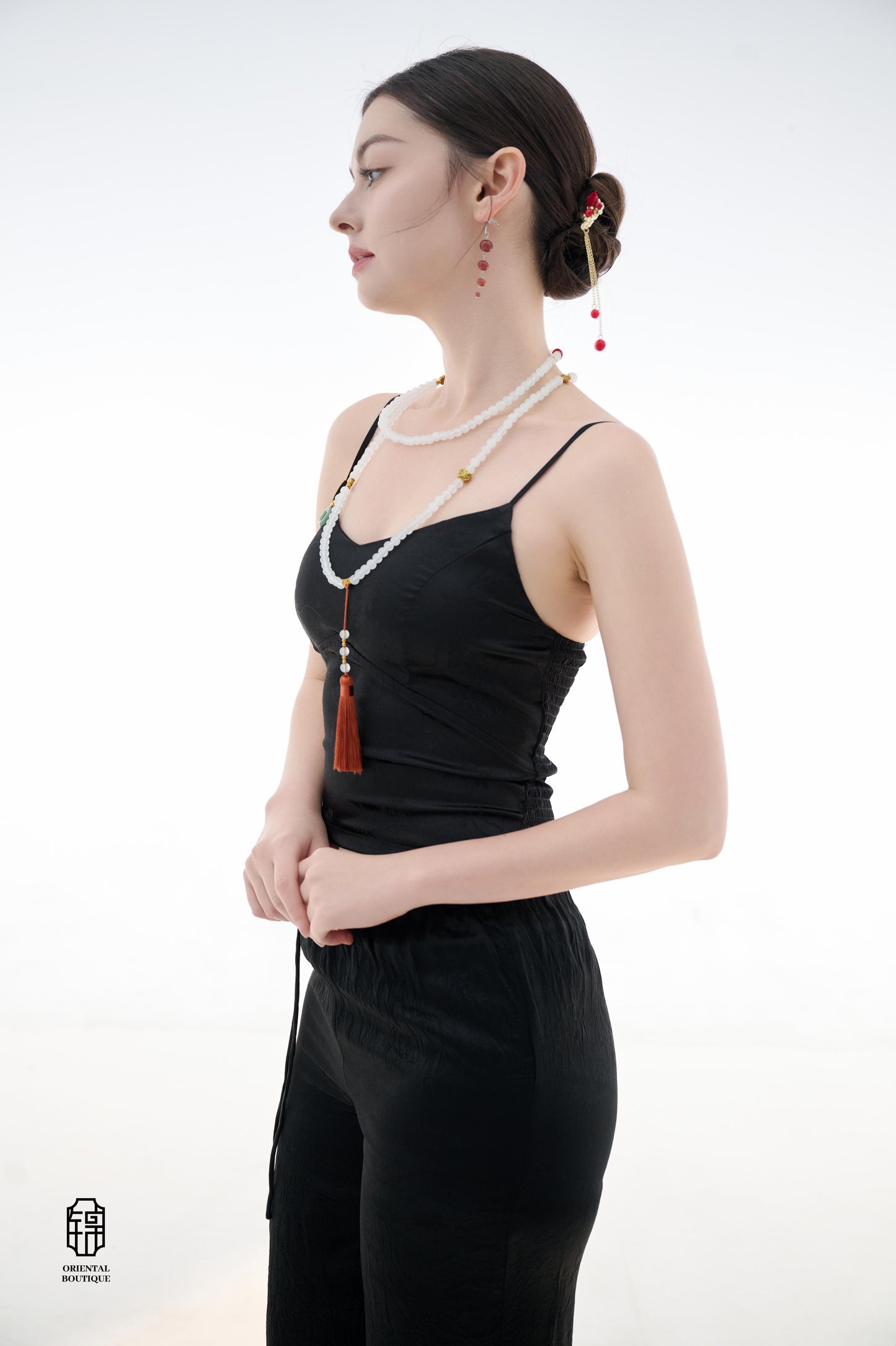 Midnight Silk Camisole,This lightweight camisole comes in classic black and elegant white, blending simplicity with a hint of allure. Crafted from airy silk fabric, it fits comfortably against the skin, beautifully highlighting the natural curves. The min