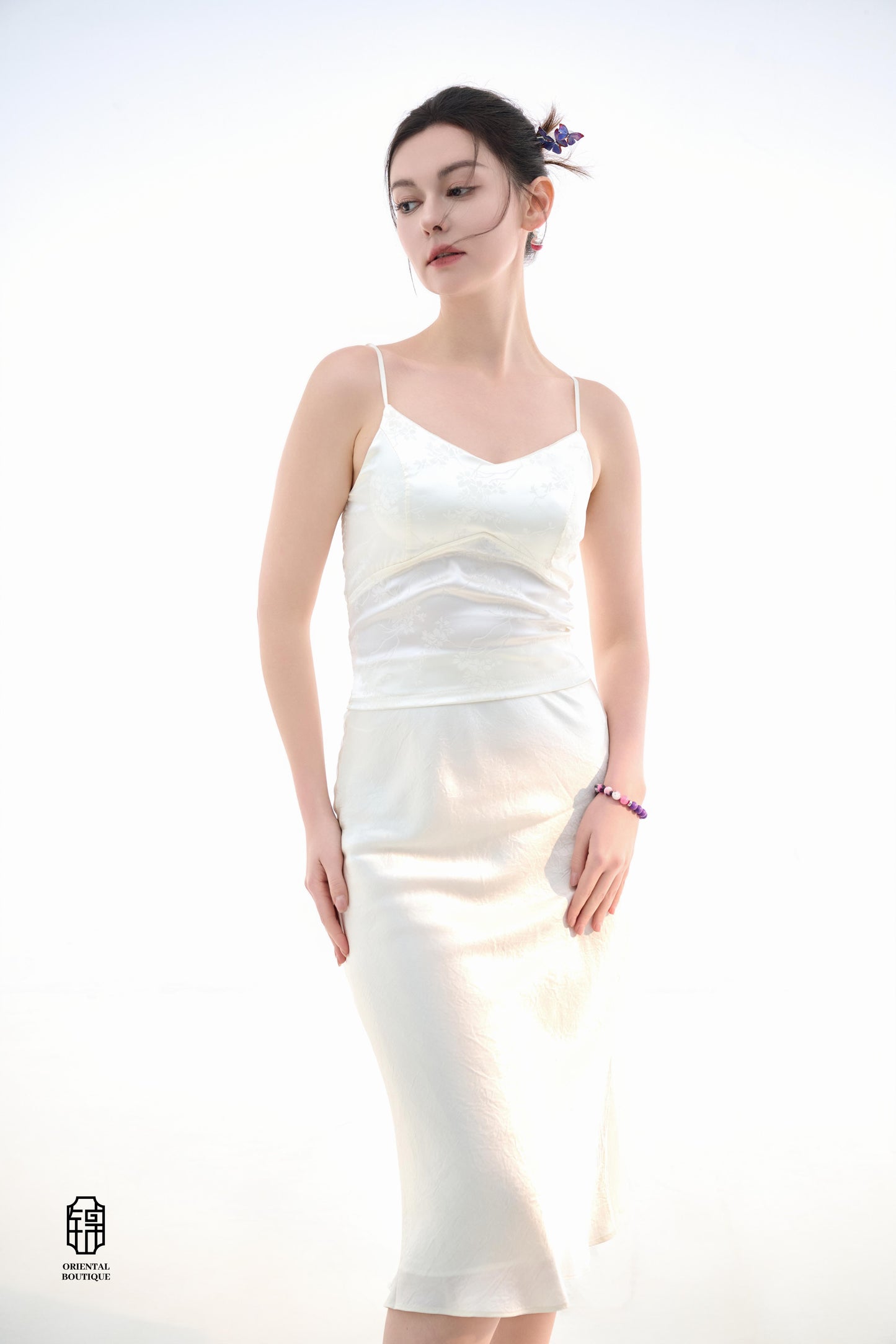 Midnight Silk Camisole,This lightweight camisole comes in classic black and elegant white, blending simplicity with a hint of allure. Crafted from airy silk fabric, it fits comfortably against the skin, beautifully highlighting the natural curves. The min