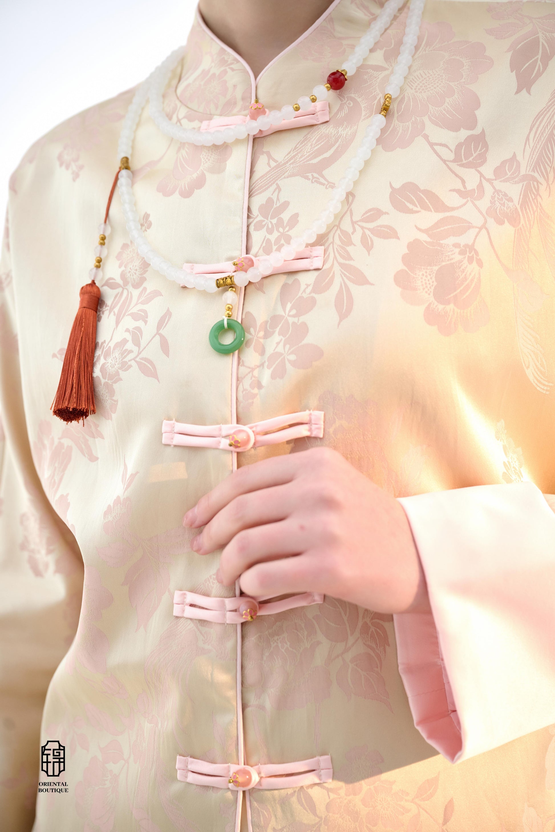 Blush Blossom Brocade Jacket,The Blush Blossom Brocade Jacket features a soft combination of blush pink and ivory, adorned with intricate floral brocade patterns, evoking a sense of elegance and grace. The frog button closures and stand-up collar add a to