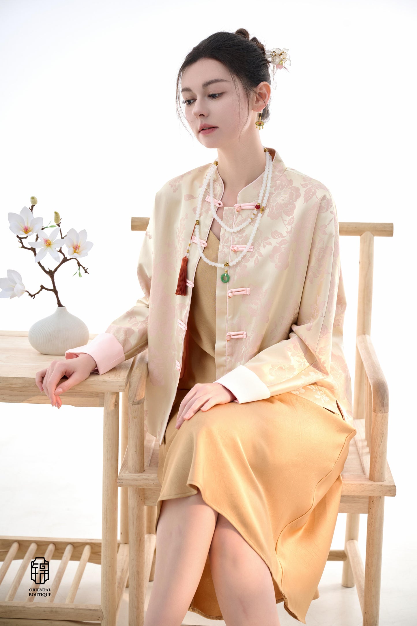 Blush Blossom Brocade Jacket,The Blush Blossom Brocade Jacket features a soft combination of blush pink and ivory, adorned with intricate floral brocade patterns, evoking a sense of elegance and grace. The frog button closures and stand-up collar add a to