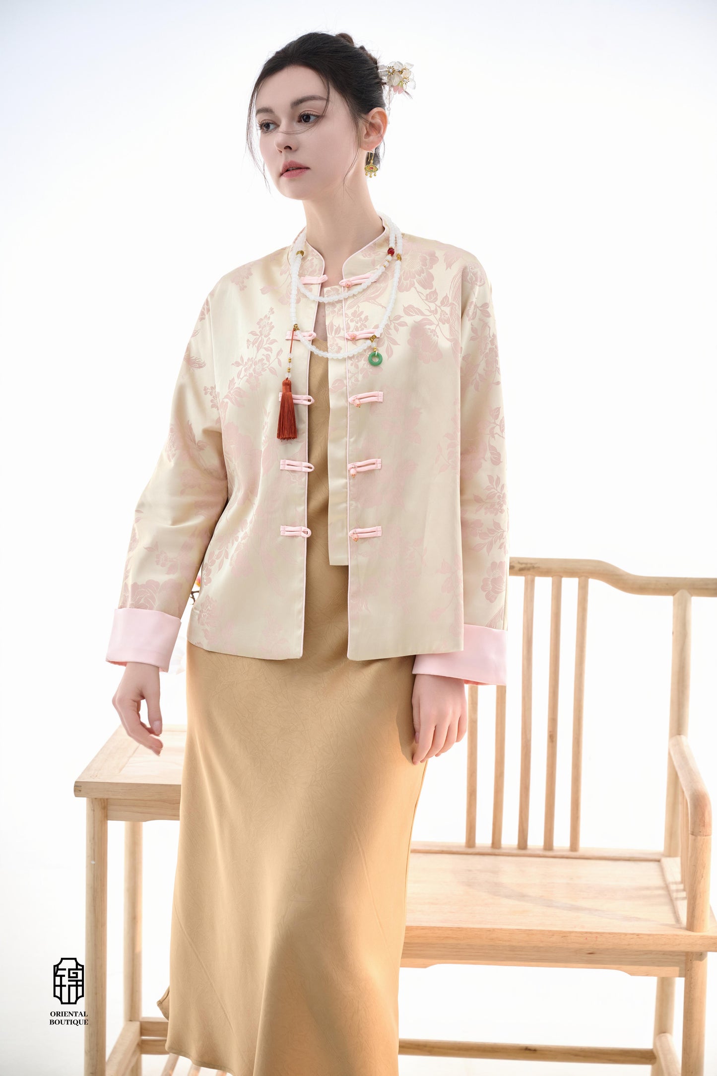 Blush Blossom Brocade Jacket,The Blush Blossom Brocade Jacket features a soft combination of blush pink and ivory, adorned with intricate floral brocade patterns, evoking a sense of elegance and grace. The frog button closures and stand-up collar add a to