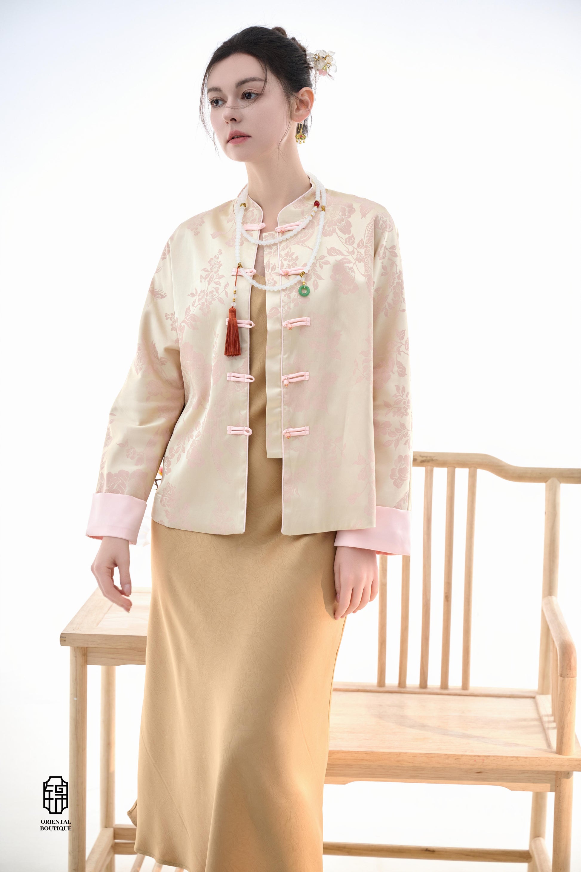 Blush Blossom Brocade Jacket,The Blush Blossom Brocade Jacket features a soft combination of blush pink and ivory, adorned with intricate floral brocade patterns, evoking a sense of elegance and grace. The frog button closures and stand-up collar add a to