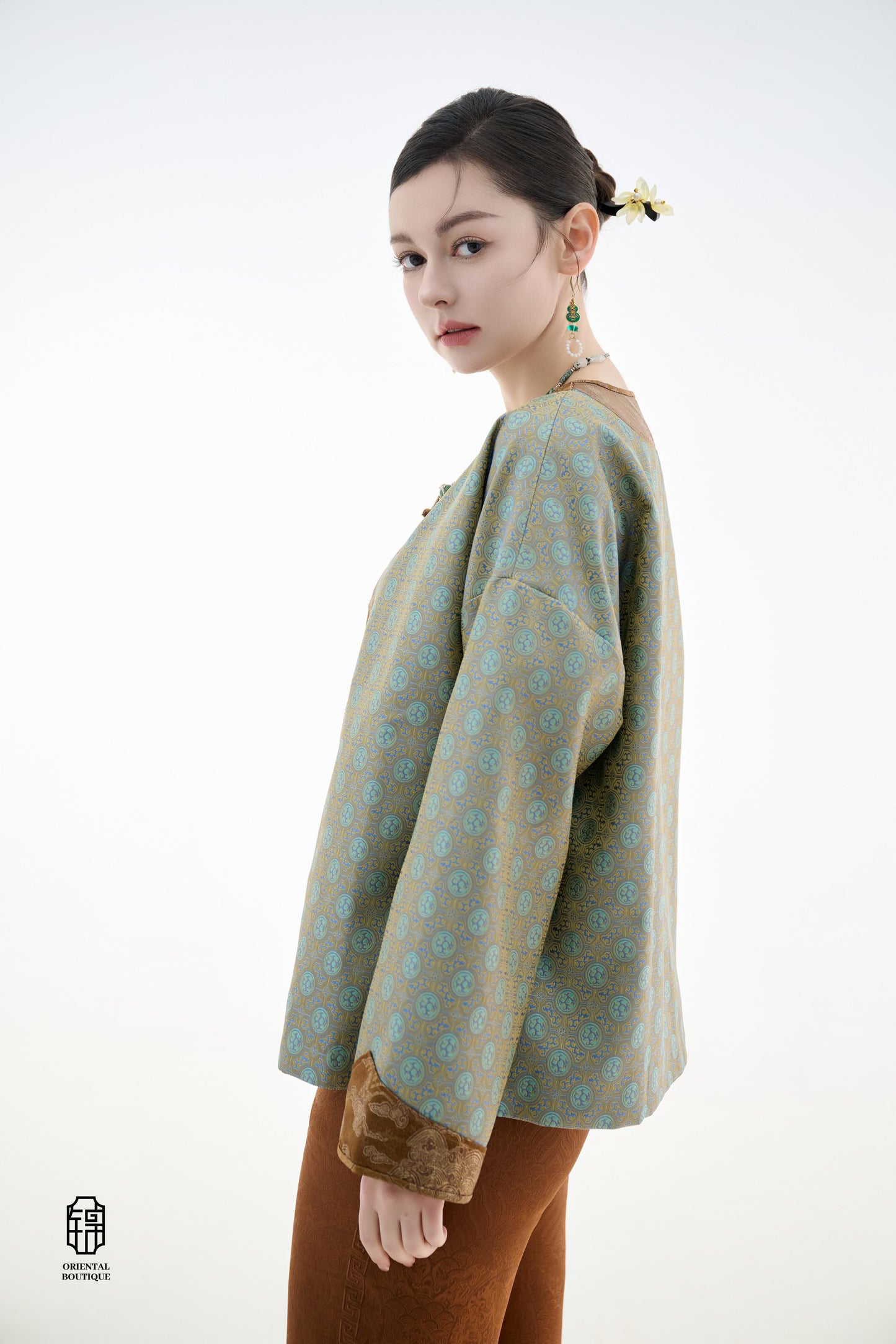 Azure Cloud Pattern Jacket,The Azure Cloud Pattern Jacket blends classical aesthetics with modern tailoring, drawing inspiration from the traditional Chinese blue and white porcelain motifs. The light blue and pale gold brocade fabric resembles the flowin