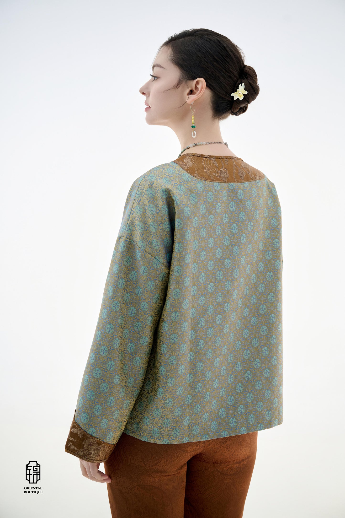 Azure Cloud Pattern Jacket,The Azure Cloud Pattern Jacket blends classical aesthetics with modern tailoring, drawing inspiration from the traditional Chinese blue and white porcelain motifs. The light blue and pale gold brocade fabric resembles the flowin