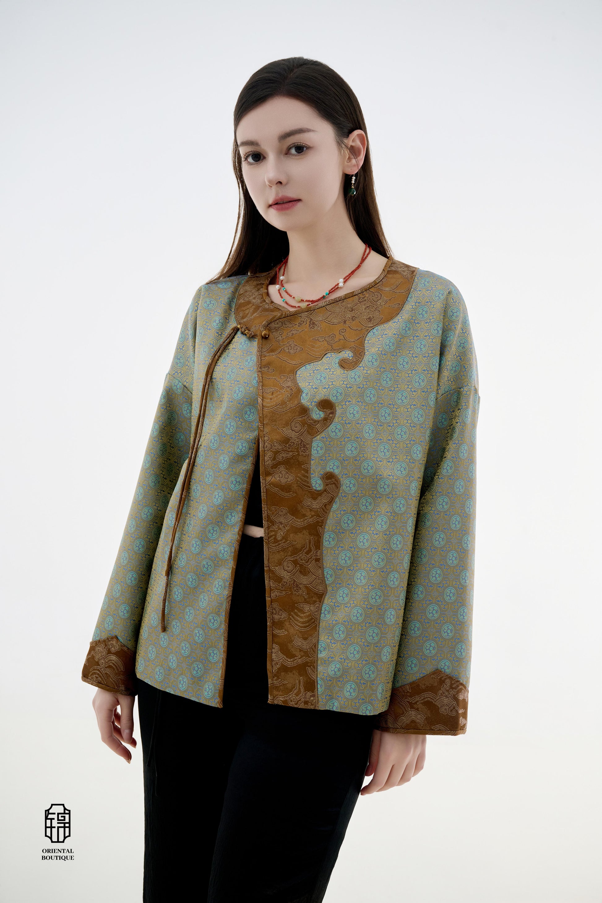 Azure Cloud Pattern Jacket,The Azure Cloud Pattern Jacket blends classical aesthetics with modern tailoring, drawing inspiration from the traditional Chinese blue and white porcelain motifs. The light blue and pale gold brocade fabric resembles the flowin