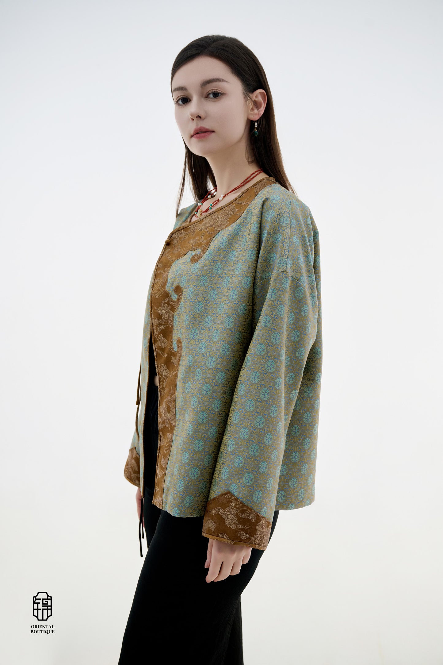 Azure Cloud Pattern Jacket,The Azure Cloud Pattern Jacket blends classical aesthetics with modern tailoring, drawing inspiration from the traditional Chinese blue and white porcelain motifs. The light blue and pale gold brocade fabric resembles the flowin