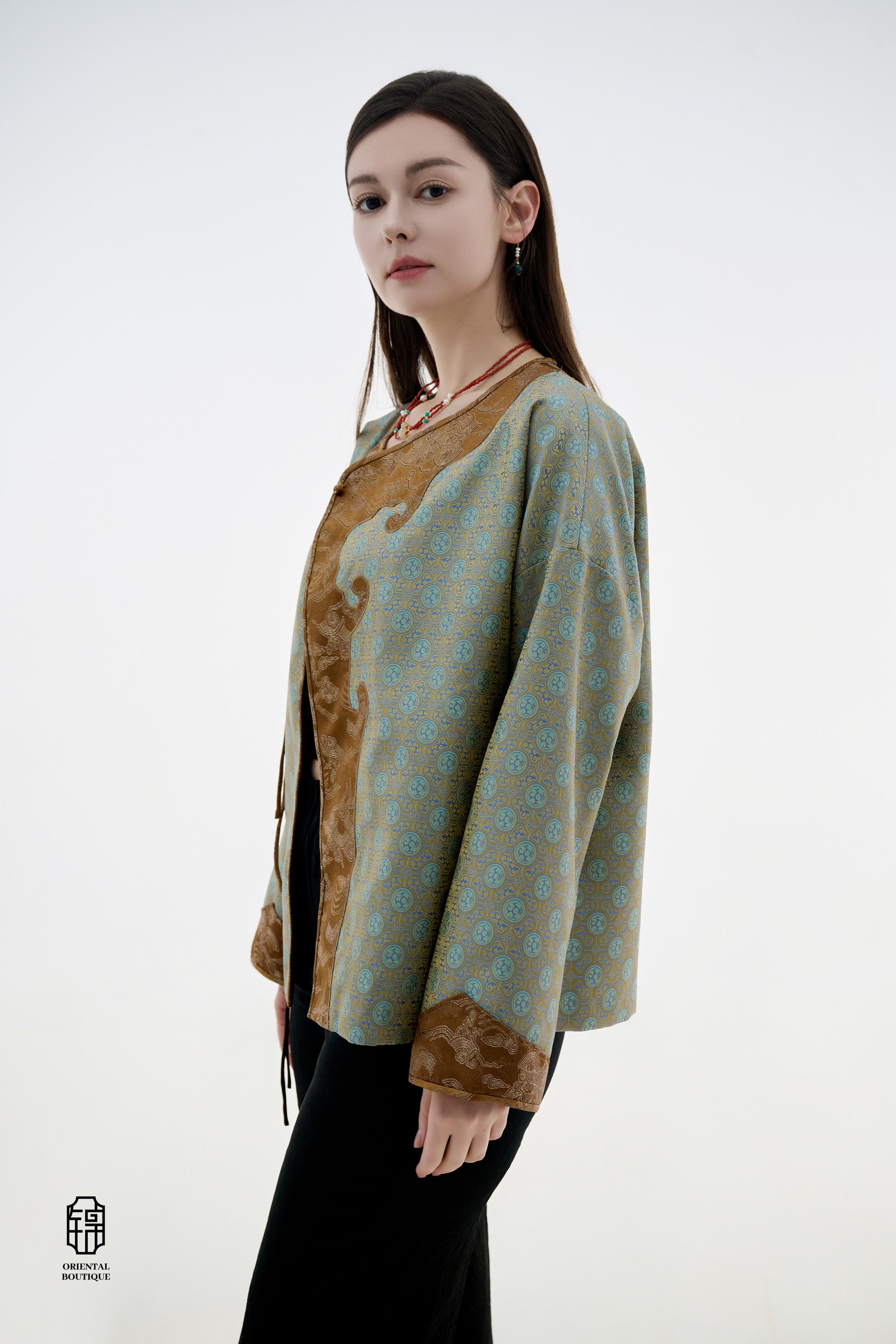 Azure Cloud Pattern Jacket,The Azure Cloud Pattern Jacket blends classical aesthetics with modern tailoring, drawing inspiration from the traditional Chinese blue and white porcelain motifs. The light blue and pale gold brocade fabric resembles the flowin