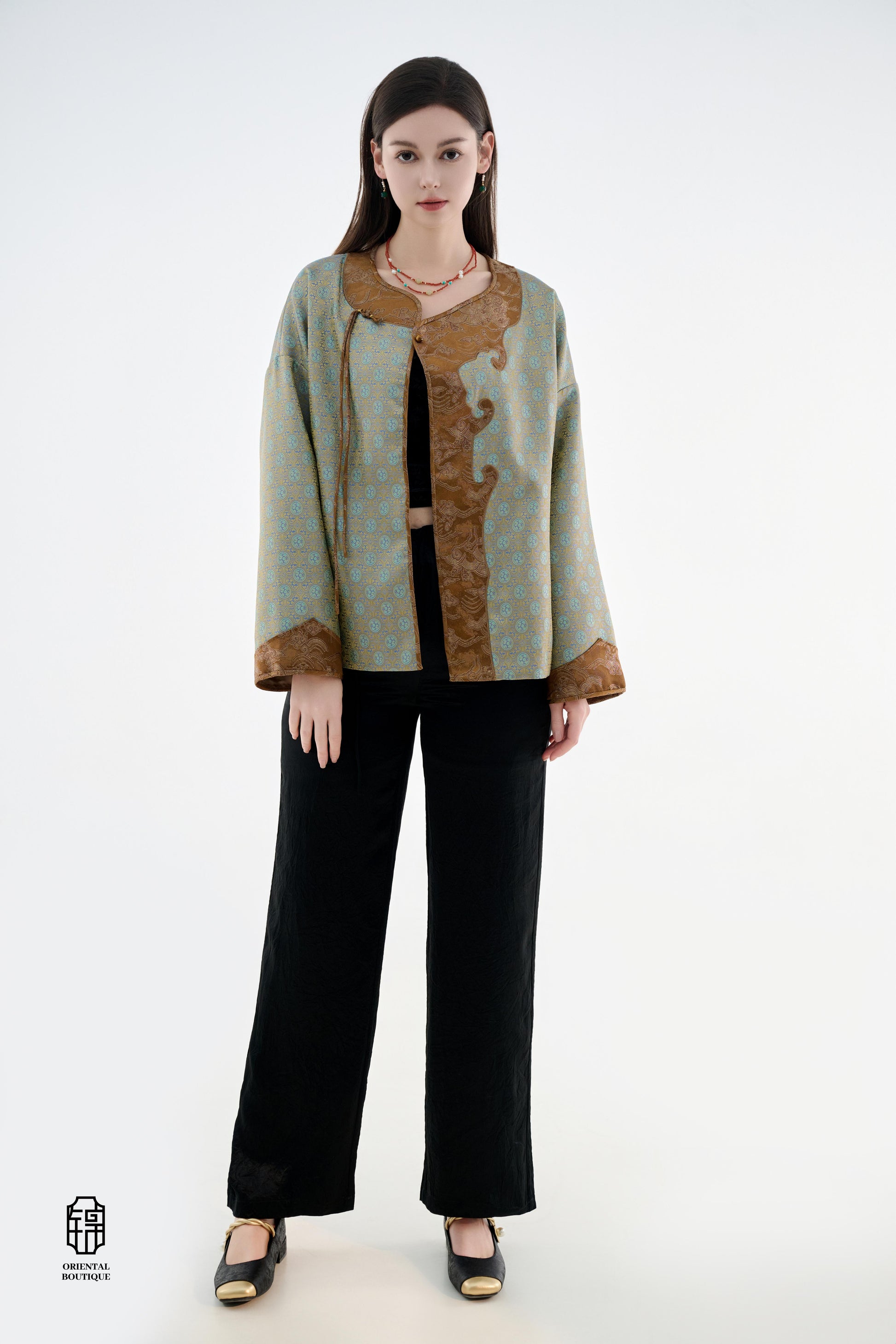 Azure Cloud Pattern Jacket,The Azure Cloud Pattern Jacket blends classical aesthetics with modern tailoring, drawing inspiration from the traditional Chinese blue and white porcelain motifs. The light blue and pale gold brocade fabric resembles the flowin