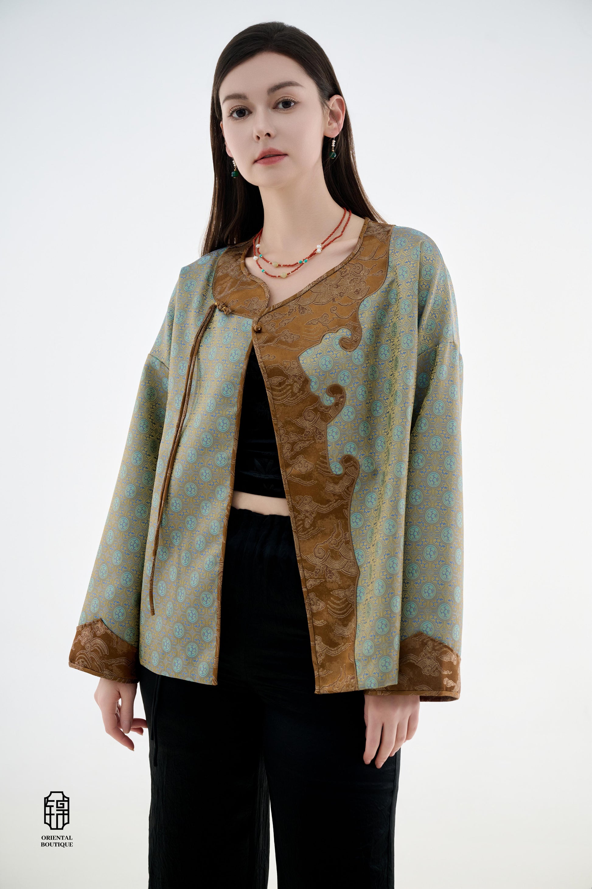Azure Cloud Pattern Jacket,The Azure Cloud Pattern Jacket blends classical aesthetics with modern tailoring, drawing inspiration from the traditional Chinese blue and white porcelain motifs. The light blue and pale gold brocade fabric resembles the flowin
