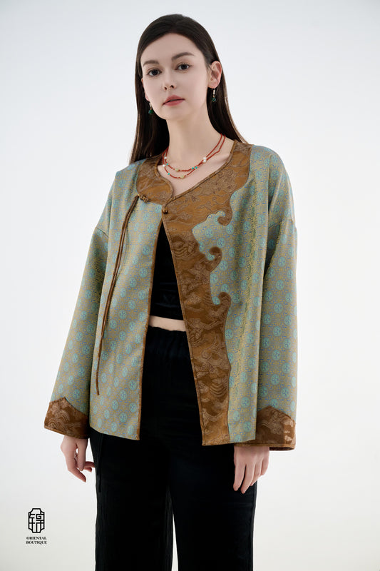 Azure Cloud Pattern Jacket,The Azure Cloud Pattern Jacket blends classical aesthetics with modern tailoring, drawing inspiration from the traditional Chinese blue and white porcelain motifs. The light blue and pale gold brocade fabric resembles the flowin
