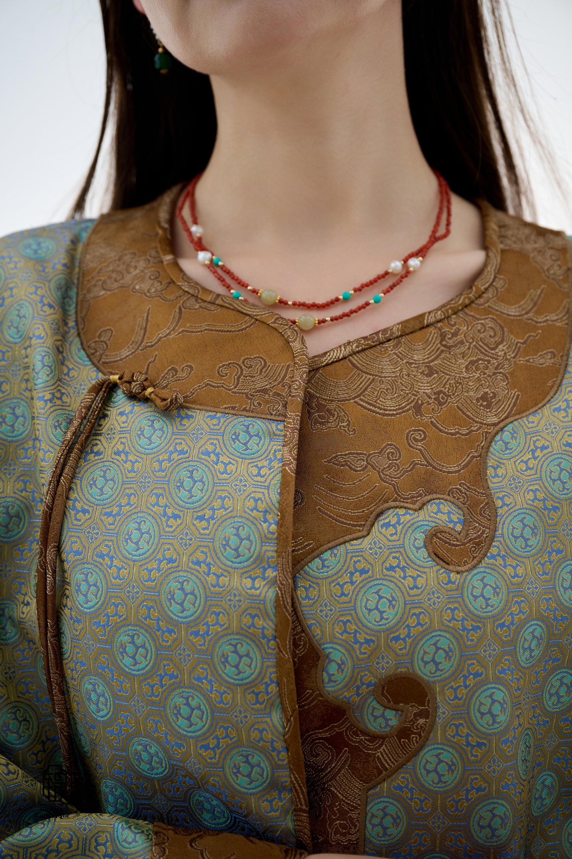 Azure Cloud Pattern Jacket,The Azure Cloud Pattern Jacket blends classical aesthetics with modern tailoring, drawing inspiration from the traditional Chinese blue and white porcelain motifs. The light blue and pale gold brocade fabric resembles the flowin