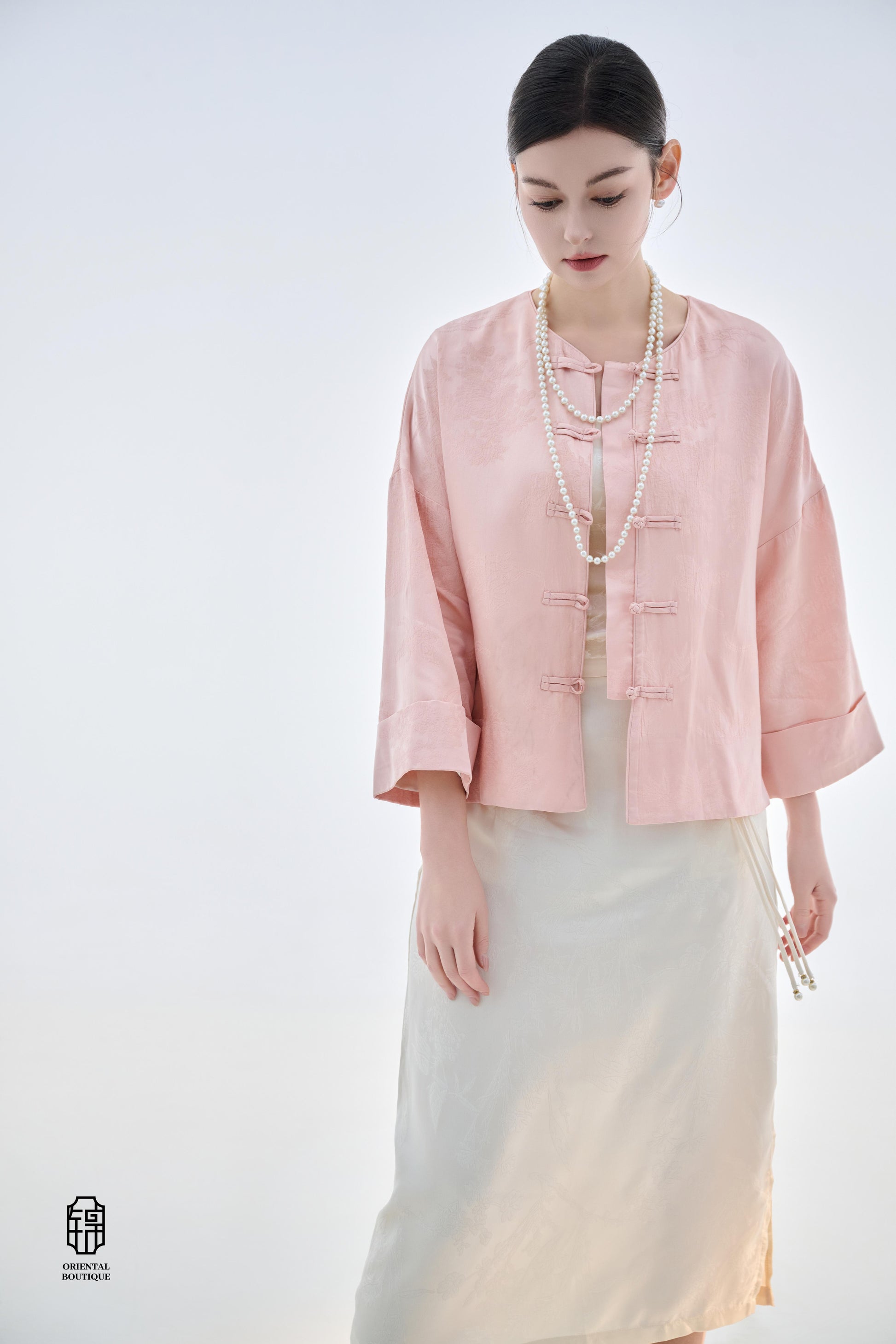 Dawn Pink Brocade Jacket,The Dawn Pink Brocade Jacket is crafted from soft pink silk fabric, offering an elegant and graceful design that exudes a gentle charm. The jacket features subtle brocade patterns on the surface, adding an understated yet refined