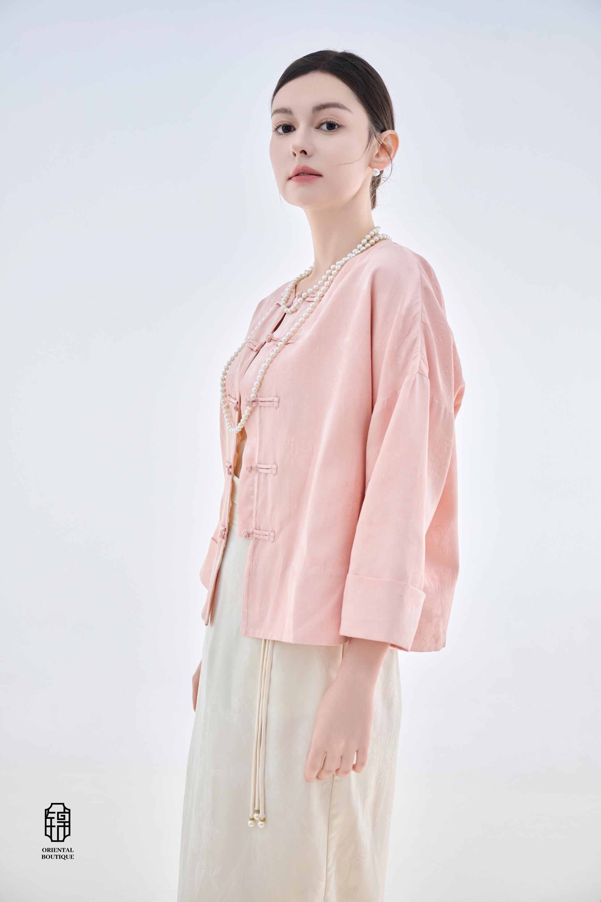 Dawn Pink Brocade Jacket,The Dawn Pink Brocade Jacket is crafted from soft pink silk fabric, offering an elegant and graceful design that exudes a gentle charm. The jacket features subtle brocade patterns on the surface, adding an understated yet refined
