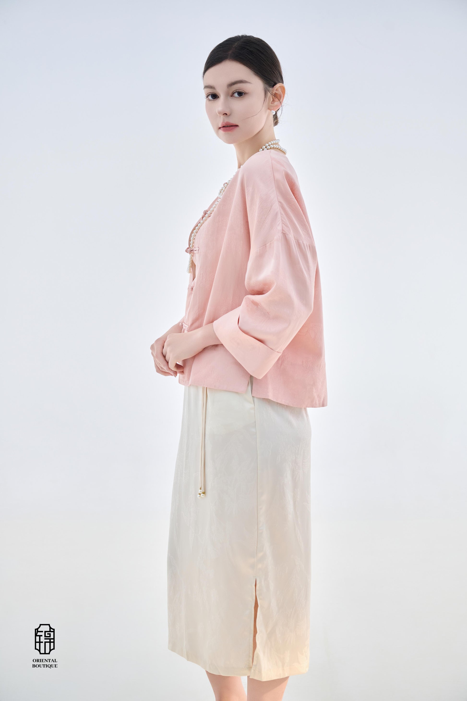 Dawn Pink Brocade Jacket,The Dawn Pink Brocade Jacket is crafted from soft pink silk fabric, offering an elegant and graceful design that exudes a gentle charm. The jacket features subtle brocade patterns on the surface, adding an understated yet refined