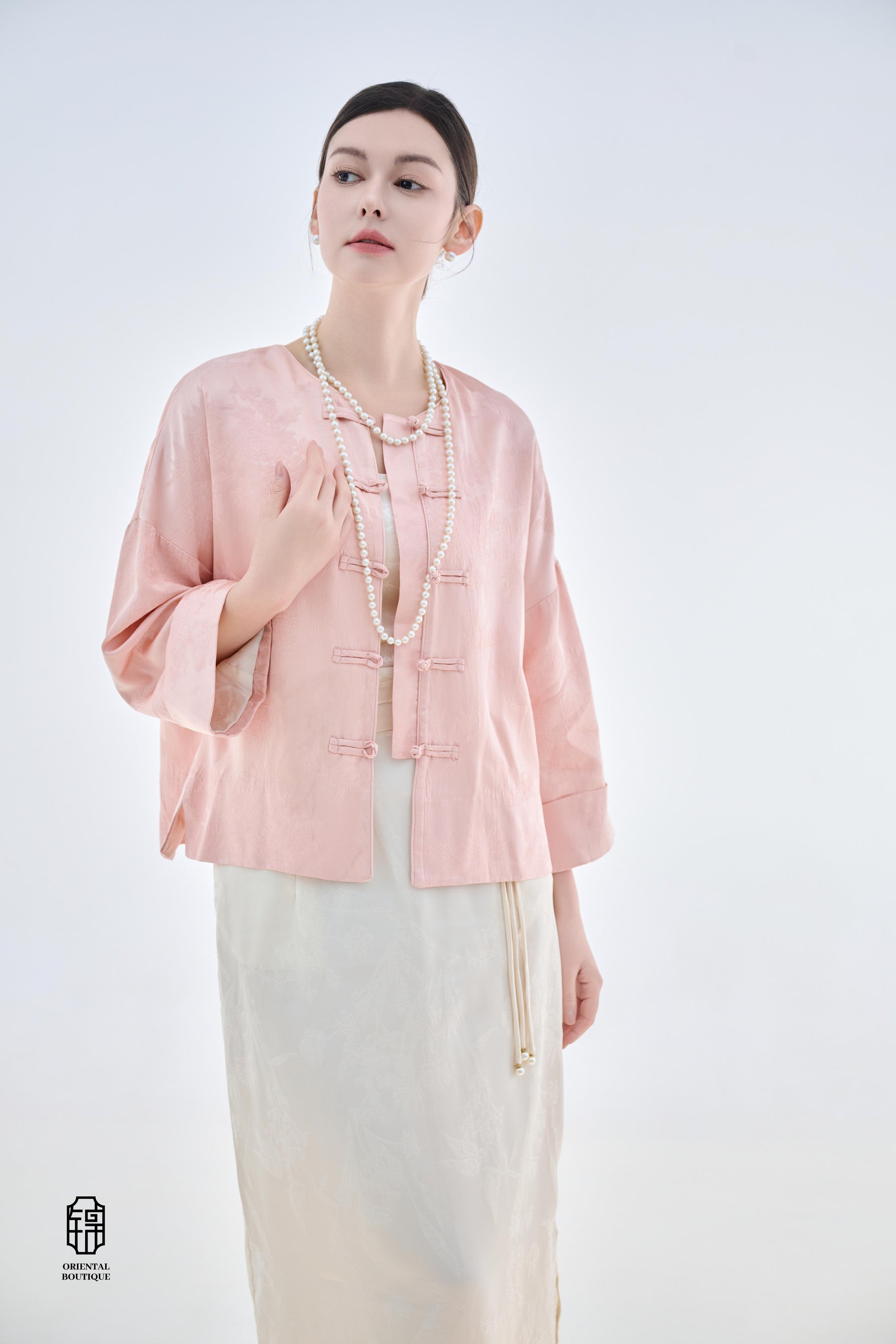 Dawn Pink Brocade Jacket,The Dawn Pink Brocade Jacket is crafted from soft pink silk fabric, offering an elegant and graceful design that exudes a gentle charm. The jacket features subtle brocade patterns on the surface, adding an understated yet refined