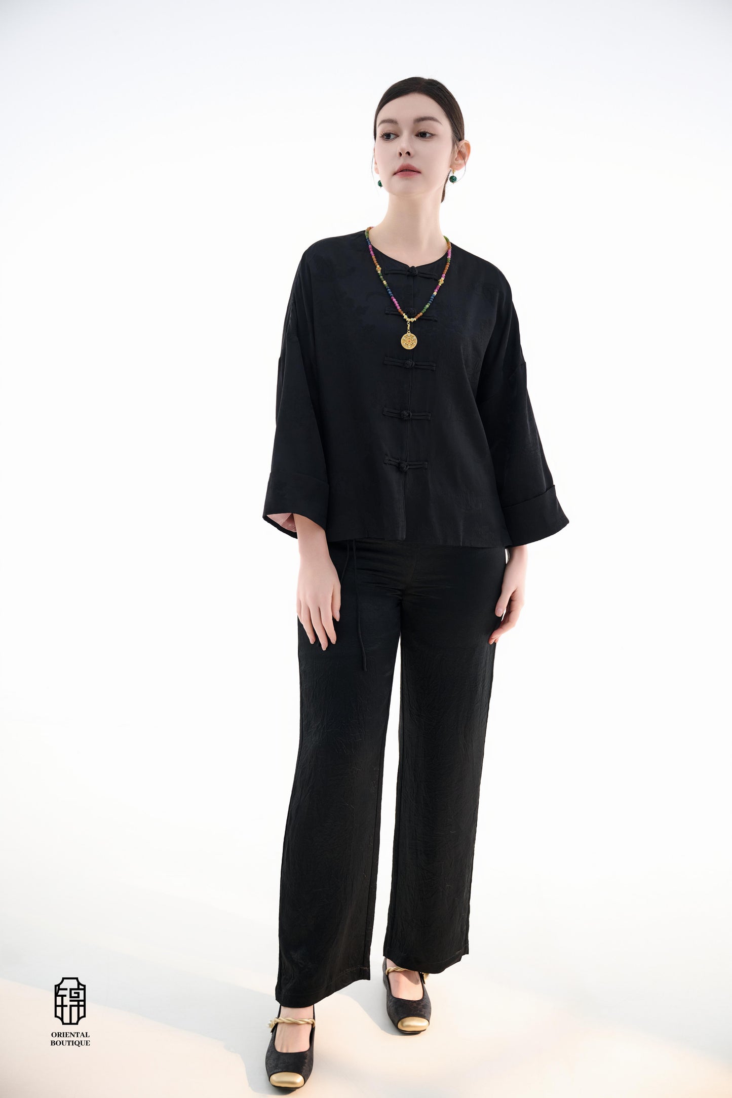 Button-up Collarless Jacket ,The Blush Sleeve Silk Jacket combines traditional and modern design elements in a sleek black silk outerwear piece. The main body is made from high-quality black silk, exuding a luxurious yet understated elegance, with subtle