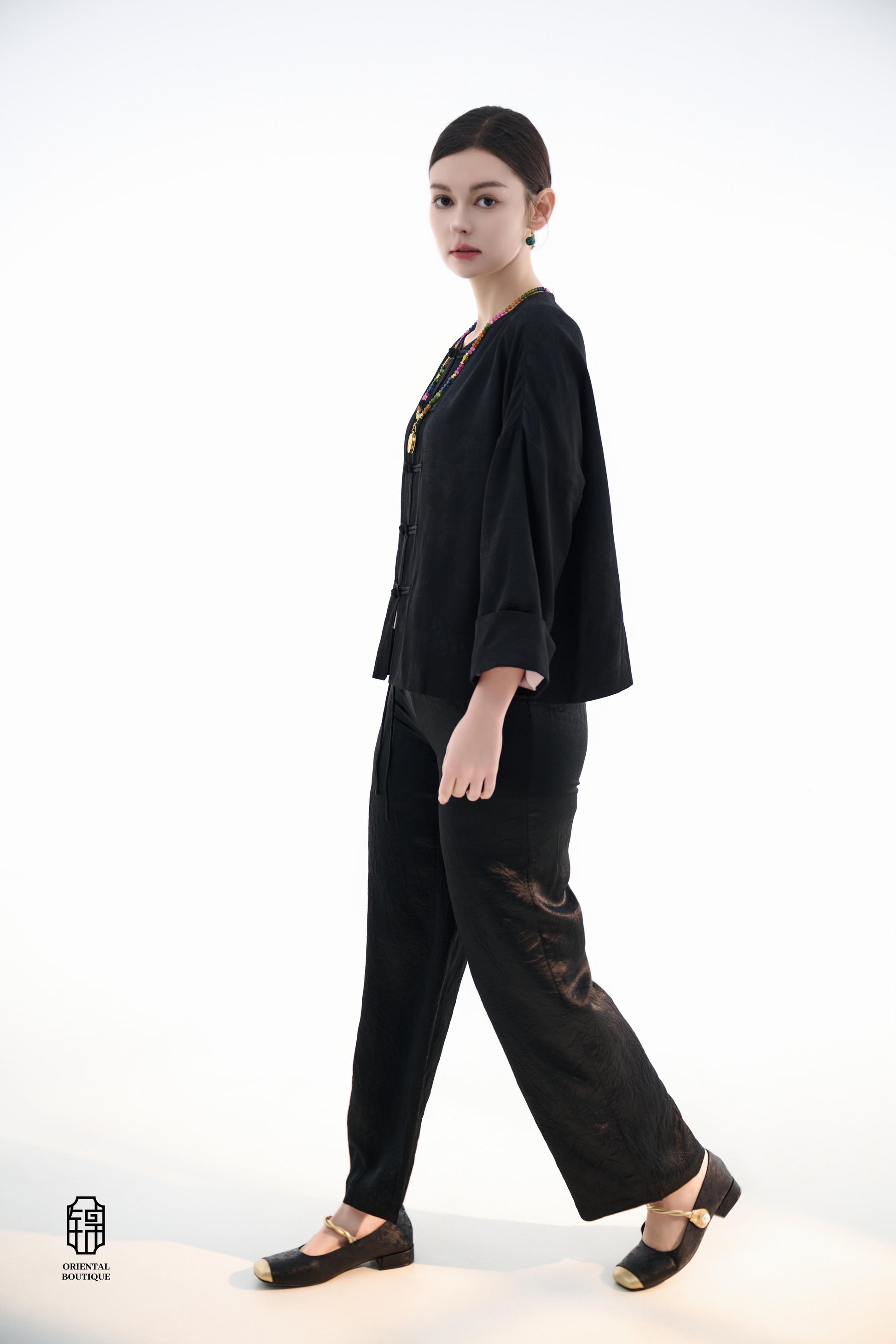 Button-up Collarless Jacket ,The Blush Sleeve Silk Jacket combines traditional and modern design elements in a sleek black silk outerwear piece. The main body is made from high-quality black silk, exuding a luxurious yet understated elegance, with subtle