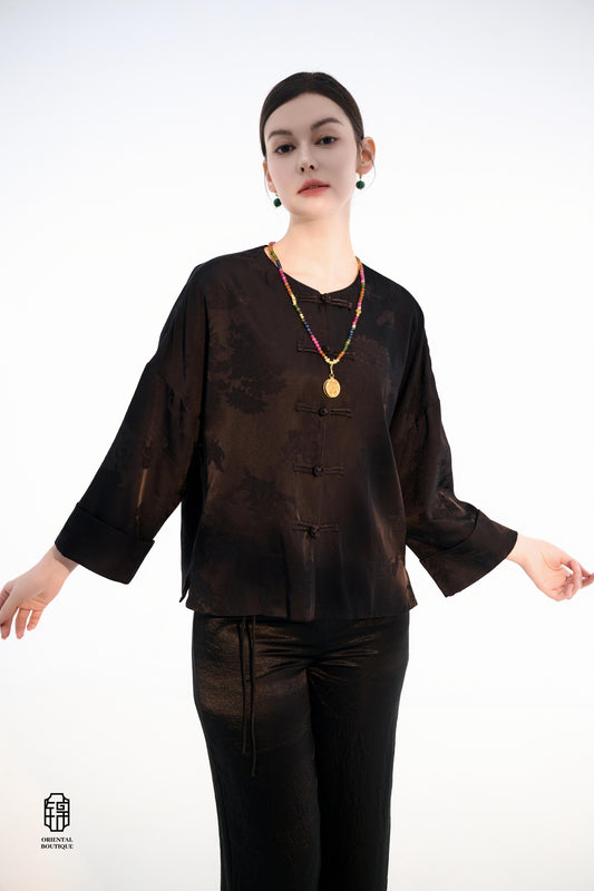 Button-up Collarless Jacket ,The Blush Sleeve Silk Jacket combines traditional and modern design elements in a sleek black silk outerwear piece. The main body is made from high-quality black silk, exuding a luxurious yet understated elegance, with subtle