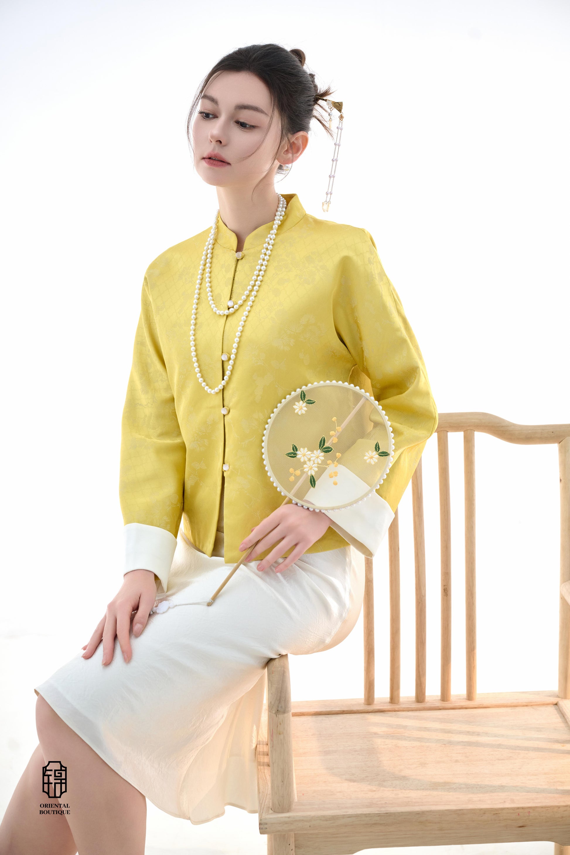 Golden Silk Fortune Blouse,The Golden Silk Fortune Blouse is crafted from vibrant golden silk, symbolizing prosperity and good fortune. The clean, high-neck design is paired with delicate jacquard patterns, exuding a sense of noble elegance. White cuffs p