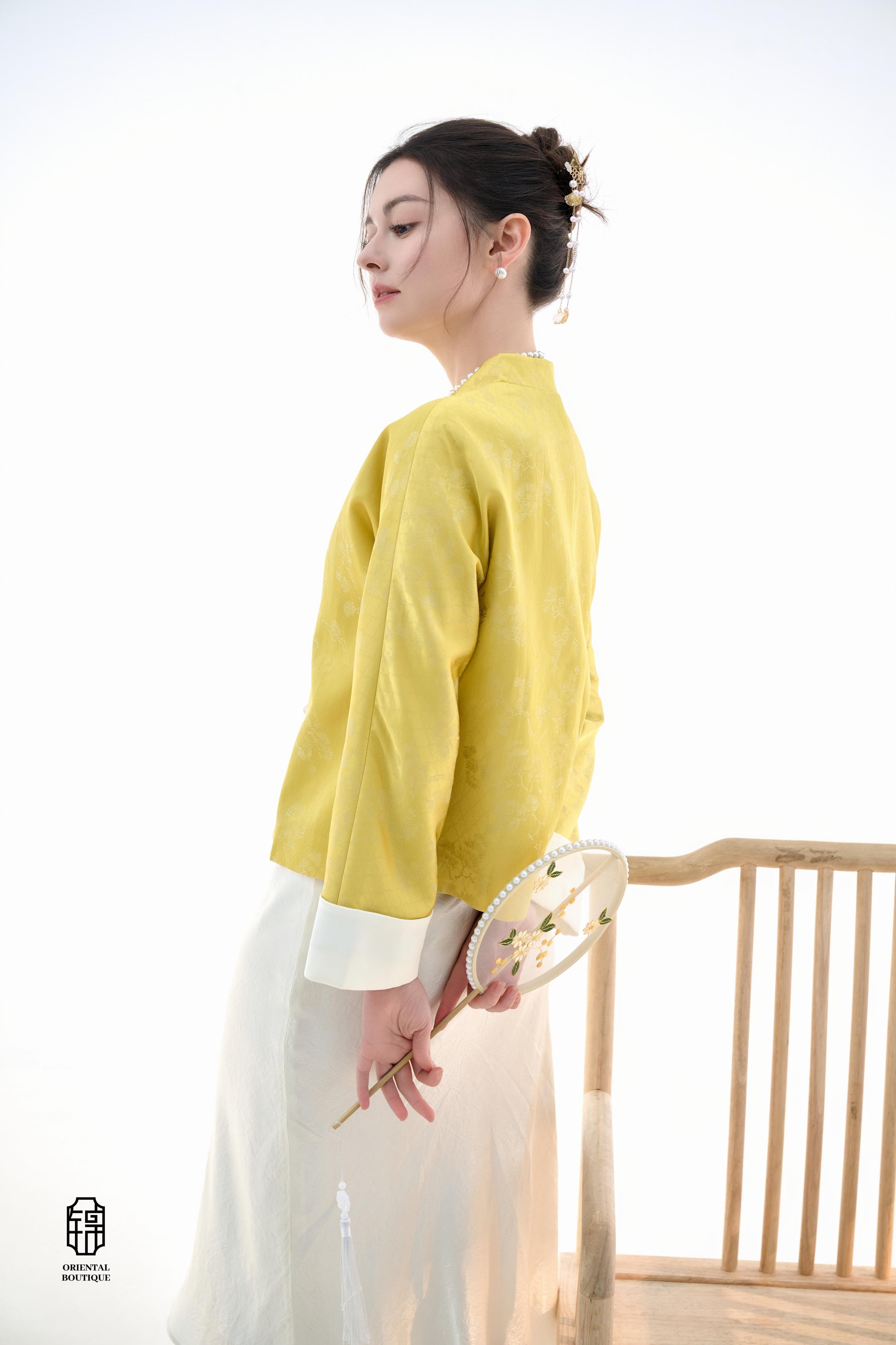Golden Silk Fortune Blouse,The Golden Silk Fortune Blouse is crafted from vibrant golden silk, symbolizing prosperity and good fortune. The clean, high-neck design is paired with delicate jacquard patterns, exuding a sense of noble elegance. White cuffs p