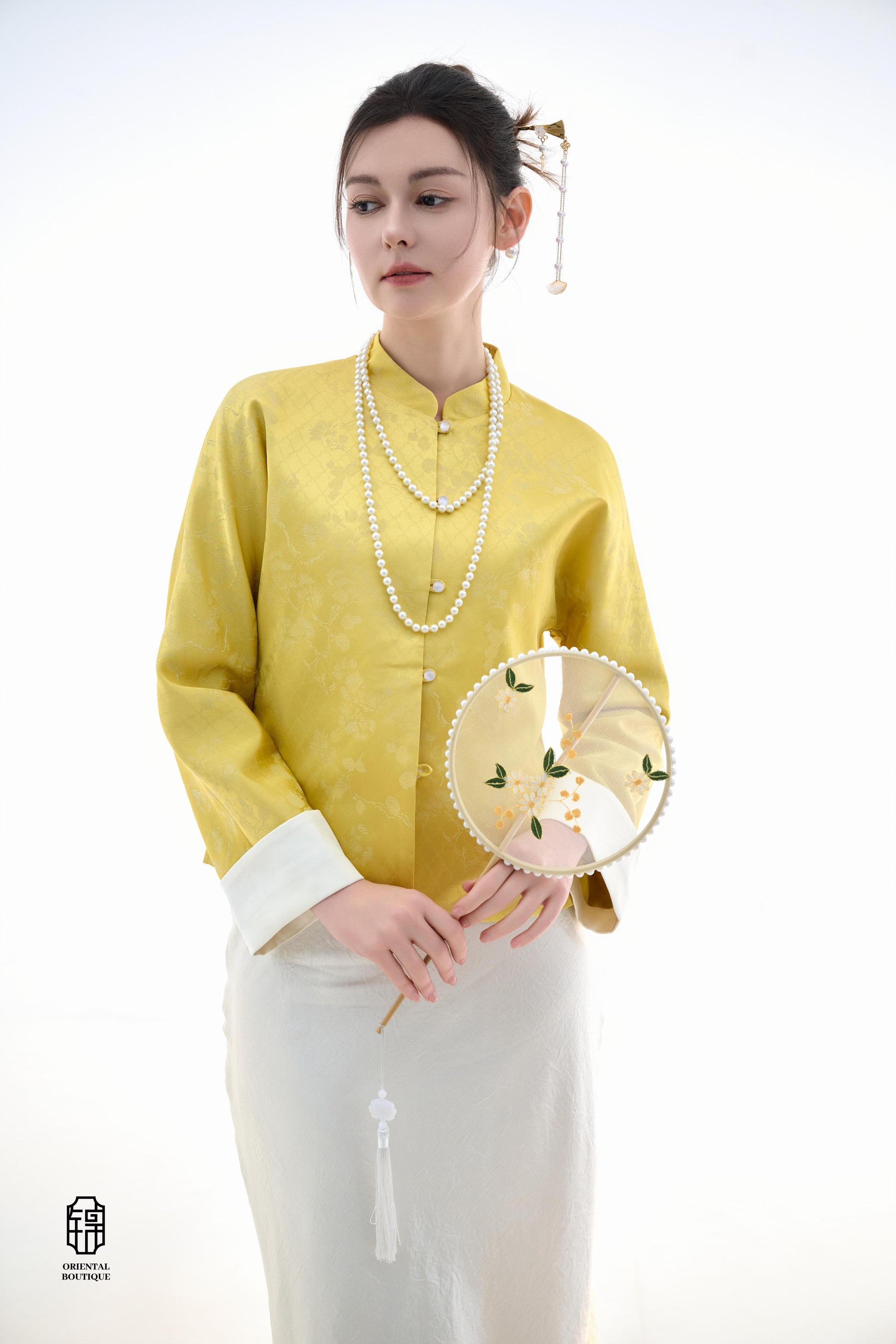 Golden Silk Fortune Blouse,The Golden Silk Fortune Blouse is crafted from vibrant golden silk, symbolizing prosperity and good fortune. The clean, high-neck design is paired with delicate jacquard patterns, exuding a sense of noble elegance. White cuffs p