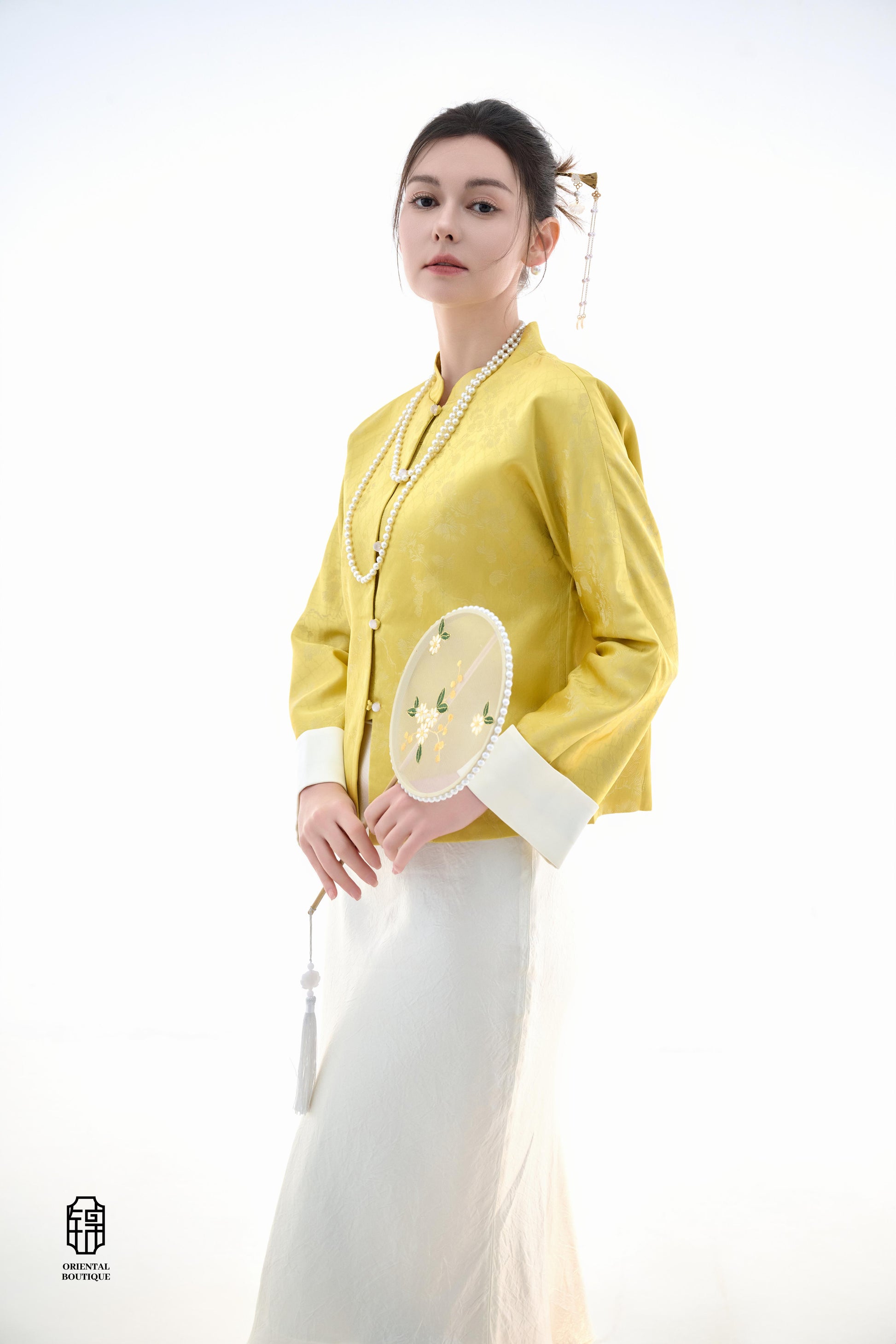 Golden Silk Fortune Blouse,The Golden Silk Fortune Blouse is crafted from vibrant golden silk, symbolizing prosperity and good fortune. The clean, high-neck design is paired with delicate jacquard patterns, exuding a sense of noble elegance. White cuffs p