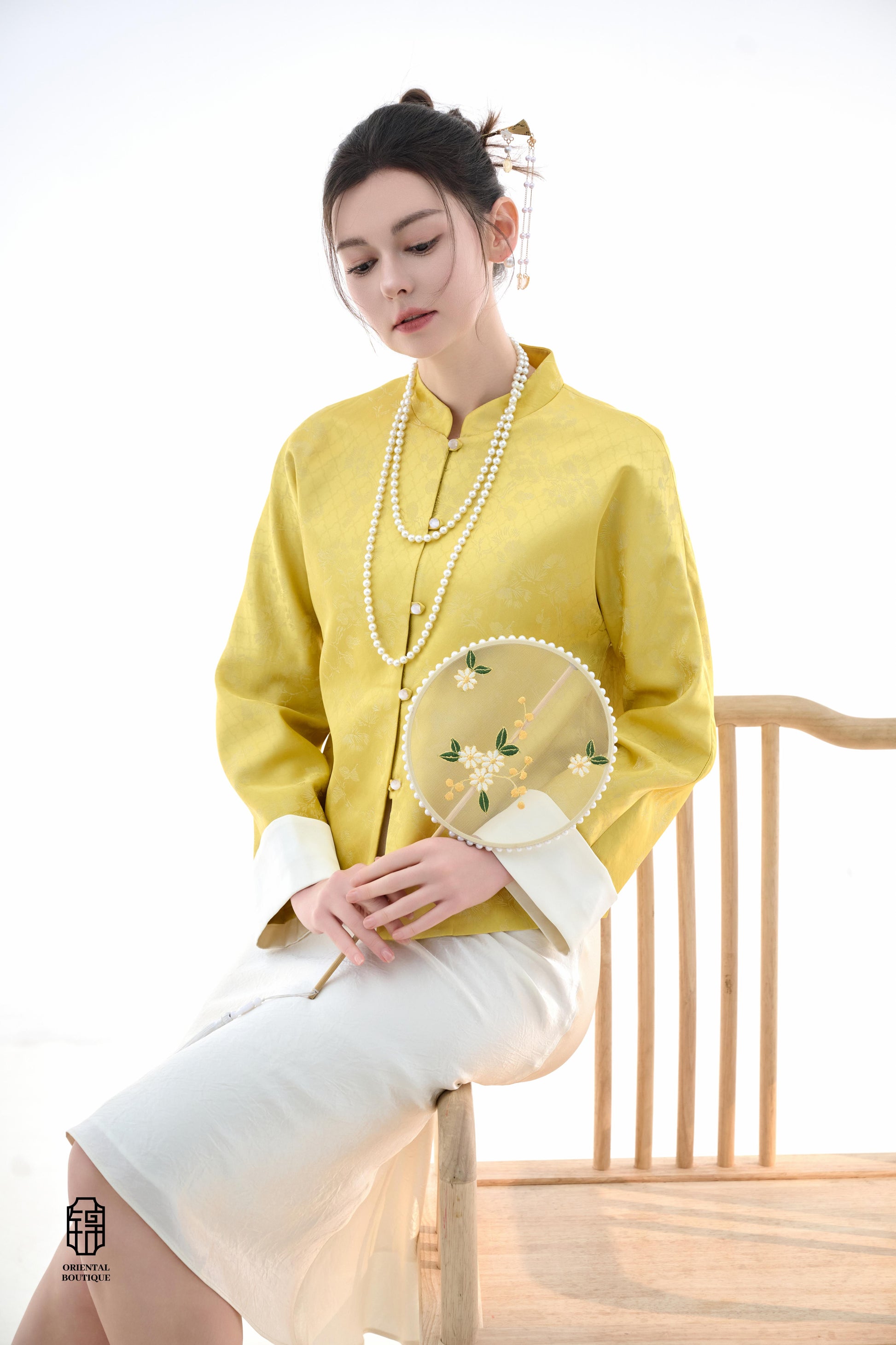 Golden Silk Fortune Blouse,The Golden Silk Fortune Blouse is crafted from vibrant golden silk, symbolizing prosperity and good fortune. The clean, high-neck design is paired with delicate jacquard patterns, exuding a sense of noble elegance. White cuffs p