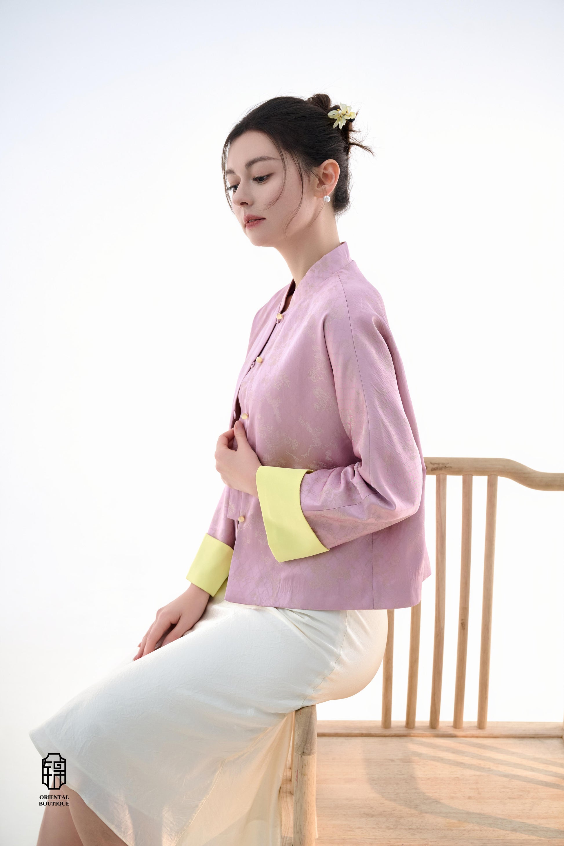 Golden Silk Purple Blouse,The Sakura Silk Brocade Blouse features a soft pink silk base adorned with delicate jacquard patterns, exuding an elegant and gentle charm. The pale yellow cuff details add a pop of brightness, breaking the monotony and enhancing