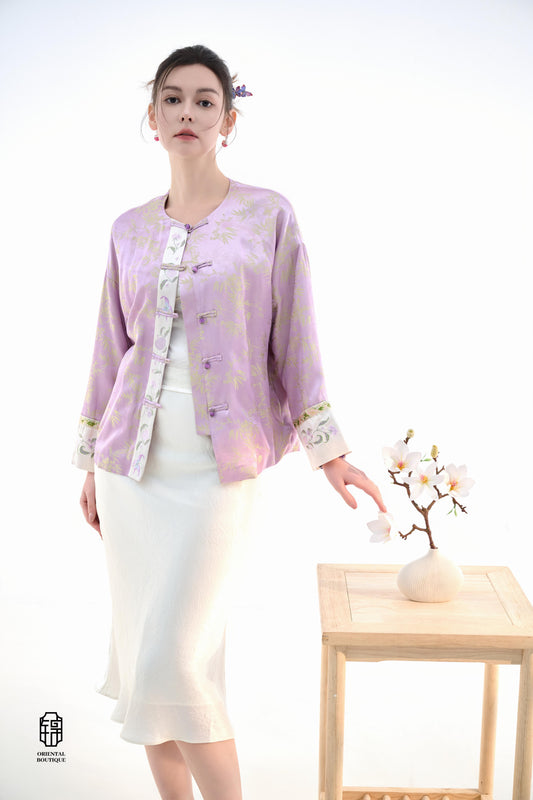 Lavender Bamboo Grace Jacket,The Lavender Bamboo Grace Jacket is made from soft lavender silk fabric, delicately embroidered with bamboo leaf patterns that evoke freshness and elegance. The cuffs and collar are lined with floral accents, adding a layer of