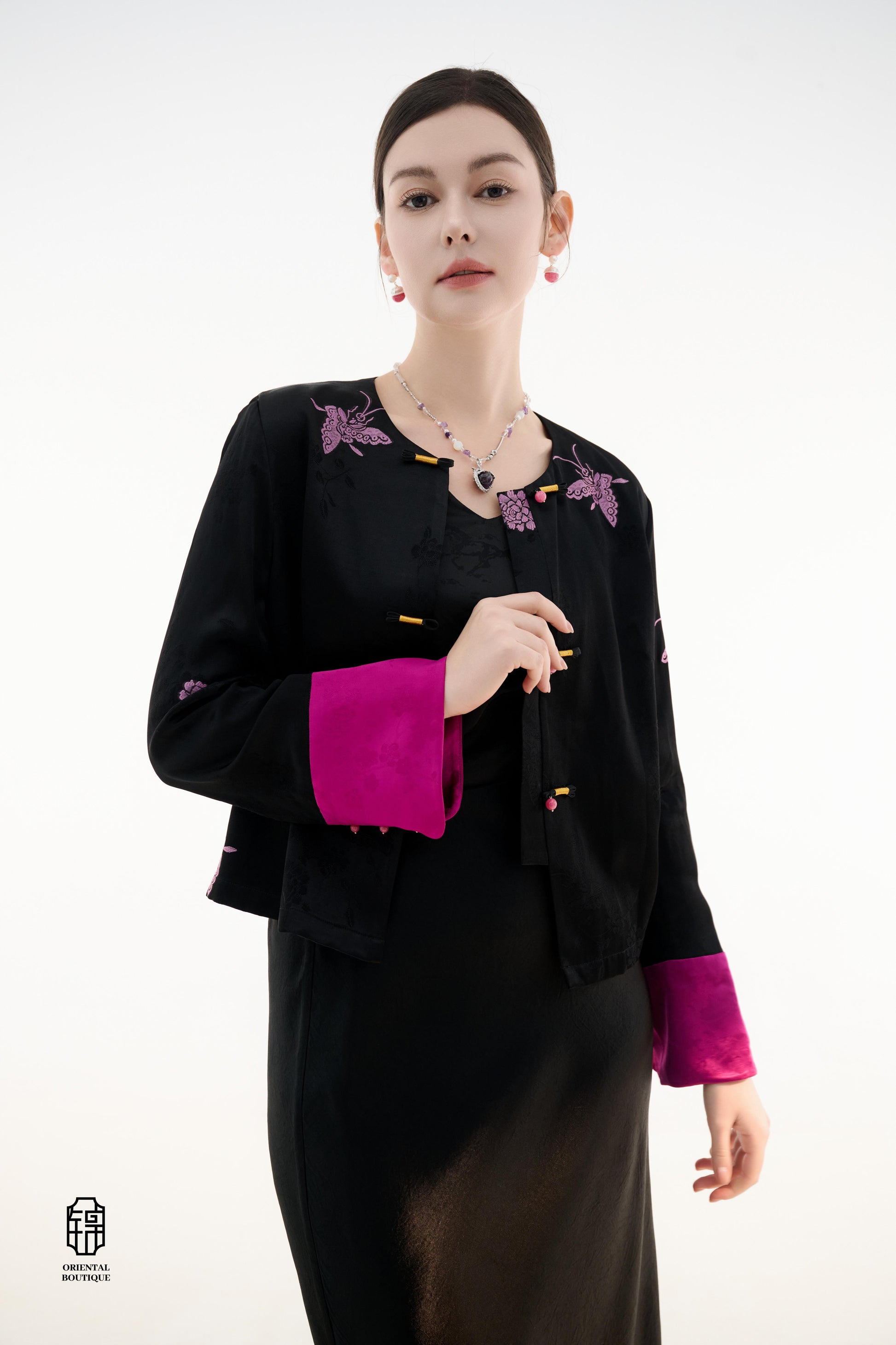 Purple Butterfly Grace Jacket,The Purple Butterfly Grace Jacket is a black outerwear piece that blends classical and modern aesthetics. Adorned with delicate purple butterfly and floral embroidery, it symbolizes elegance and romance. The unique button des