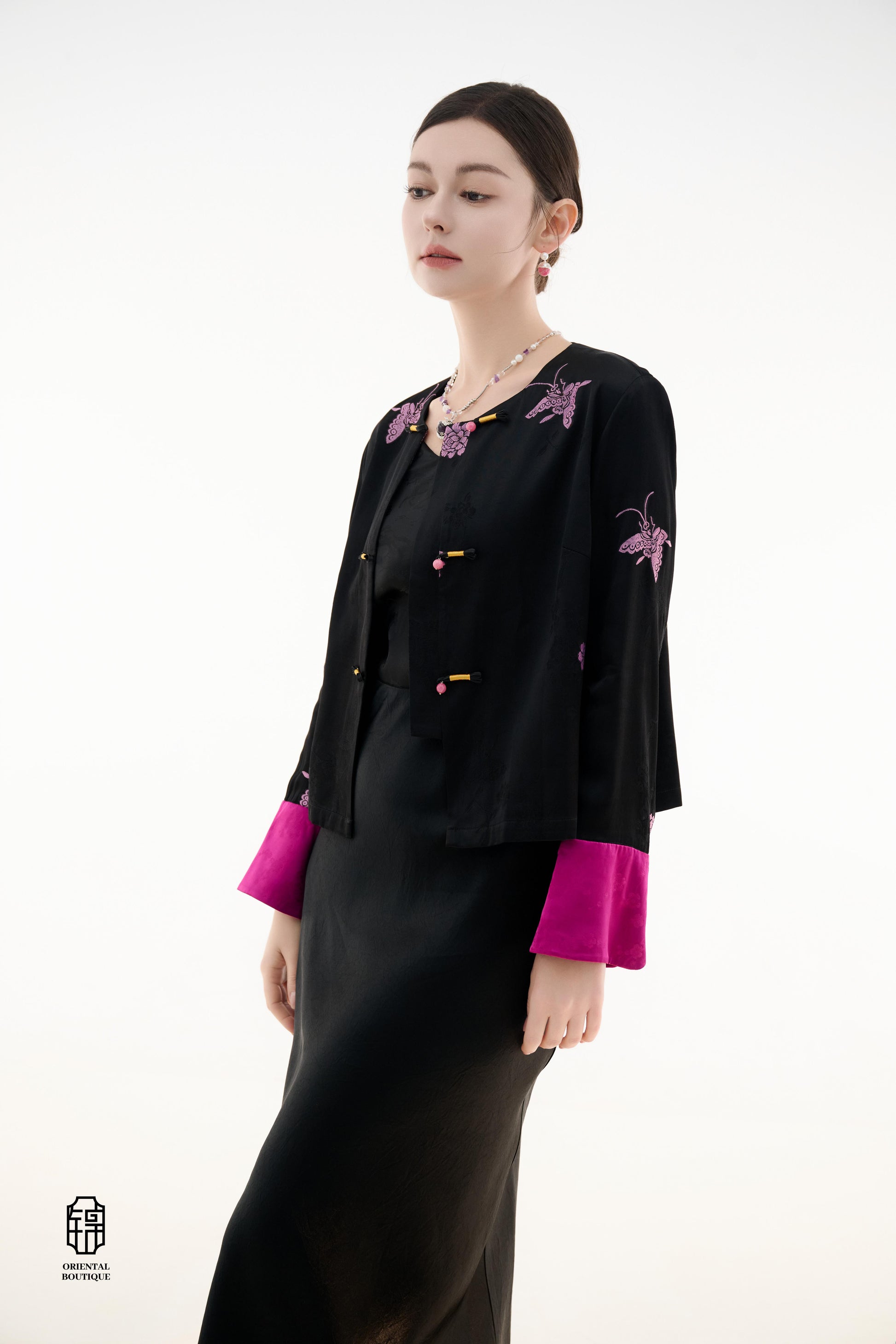 Purple Butterfly Grace Jacket,The Purple Butterfly Grace Jacket is a black outerwear piece that blends classical and modern aesthetics. Adorned with delicate purple butterfly and floral embroidery, it symbolizes elegance and romance. The unique button des