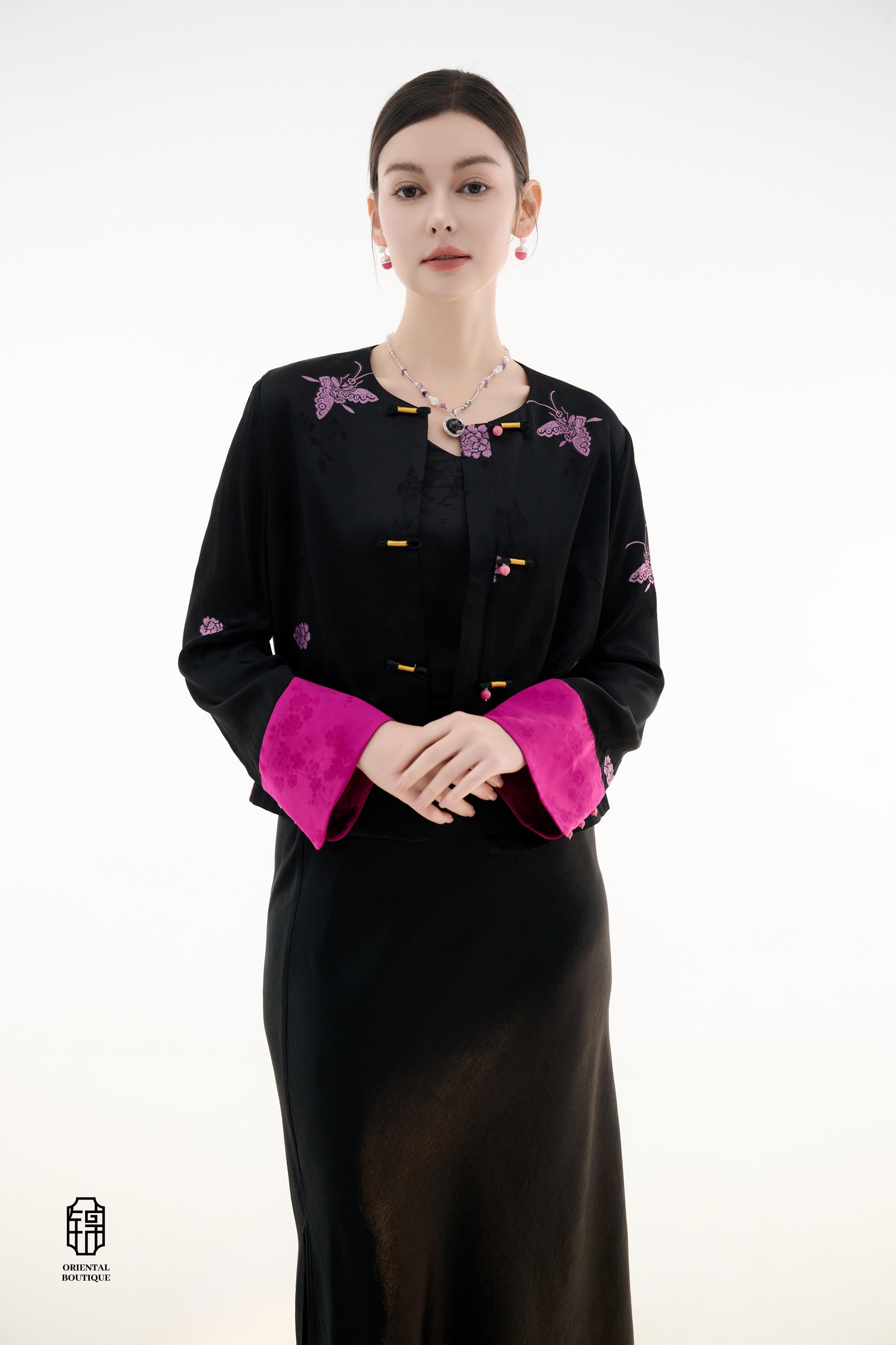 Purple Butterfly Grace Jacket,The Purple Butterfly Grace Jacket is a black outerwear piece that blends classical and modern aesthetics. Adorned with delicate purple butterfly and floral embroidery, it symbolizes elegance and romance. The unique button des