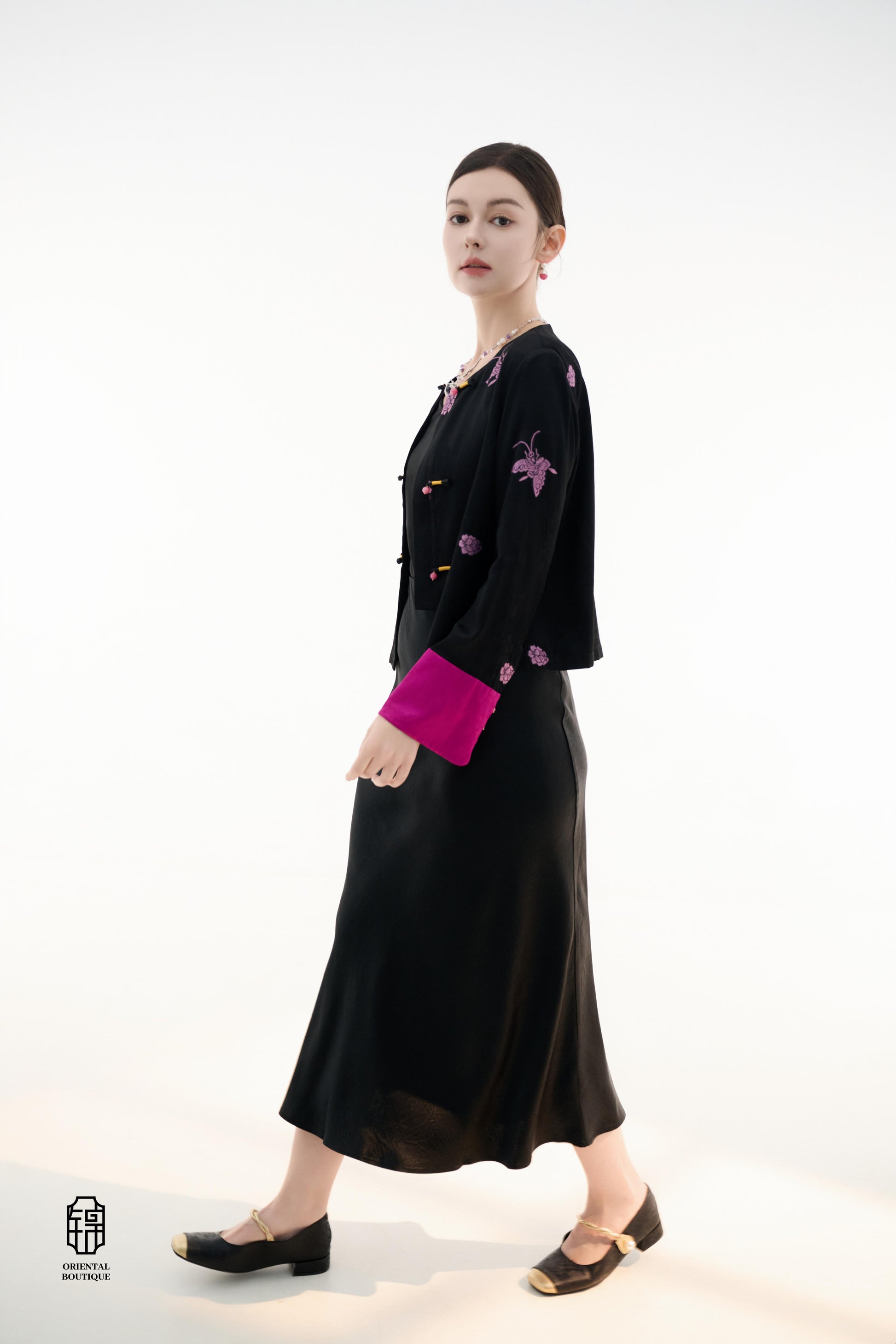 Purple Butterfly Grace Jacket,The Purple Butterfly Grace Jacket is a black outerwear piece that blends classical and modern aesthetics. Adorned with delicate purple butterfly and floral embroidery, it symbolizes elegance and romance. The unique button des