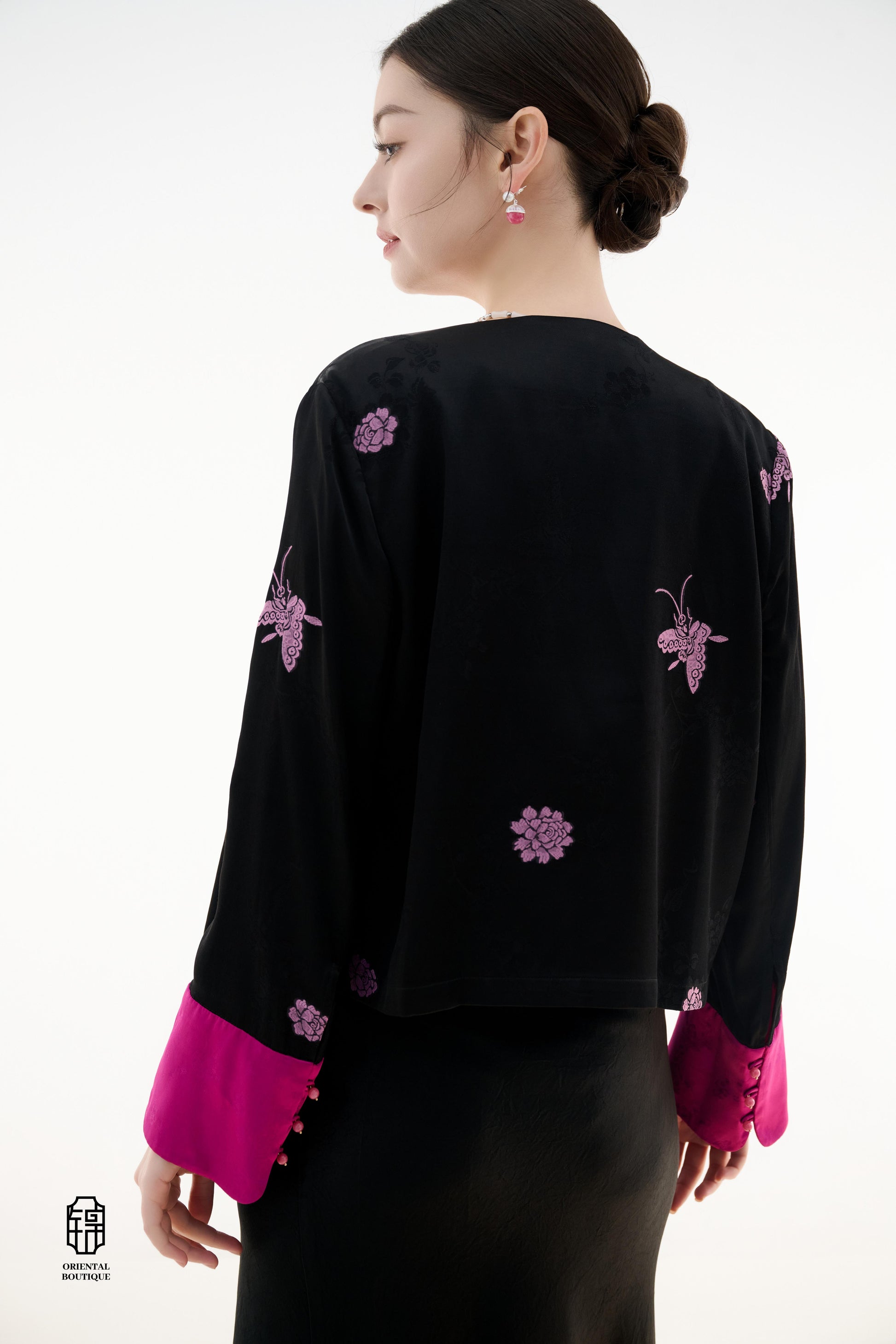 Purple Butterfly Grace Jacket,The Purple Butterfly Grace Jacket is a black outerwear piece that blends classical and modern aesthetics. Adorned with delicate purple butterfly and floral embroidery, it symbolizes elegance and romance. The unique button des