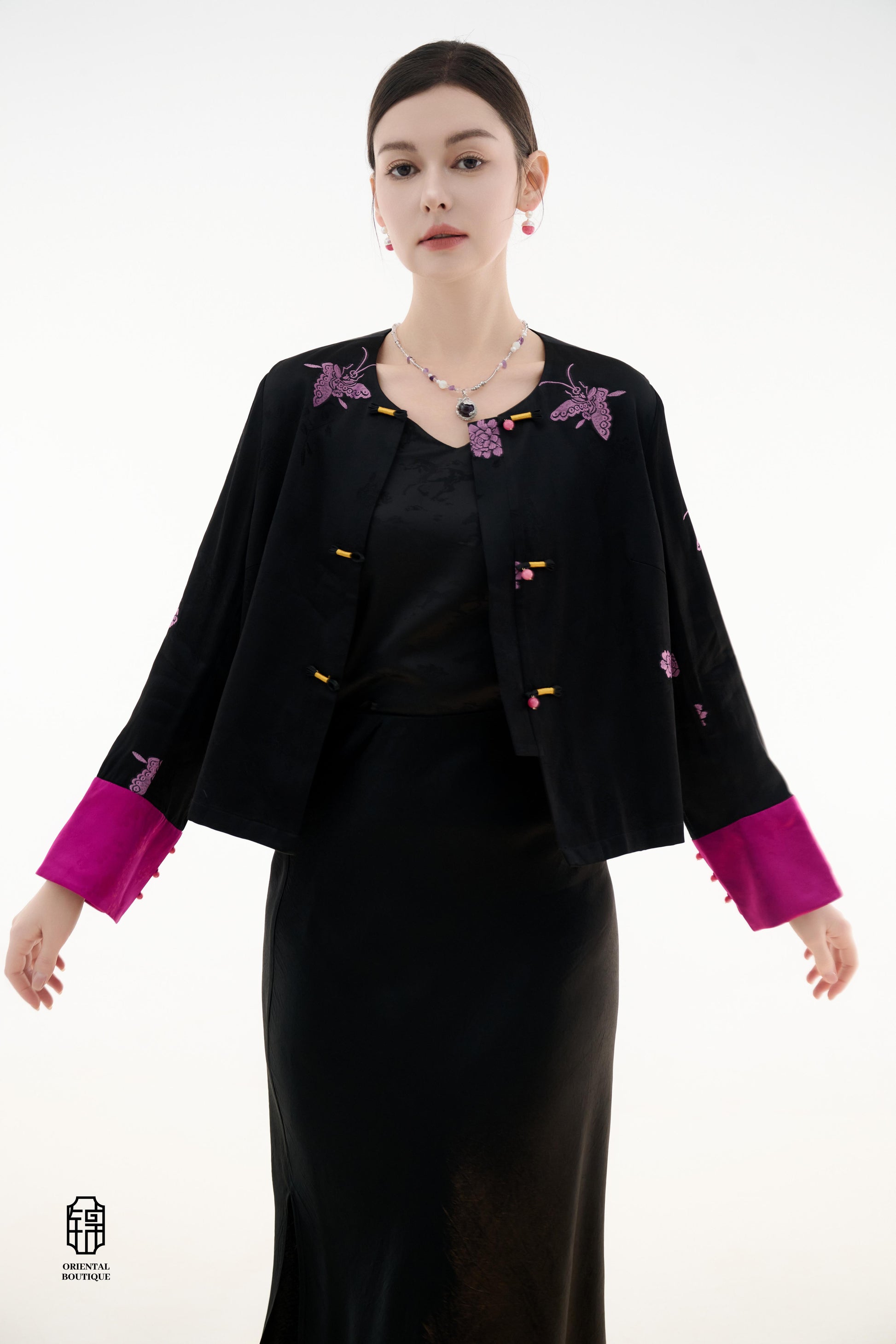 Purple Butterfly Grace Jacket,The Purple Butterfly Grace Jacket is a black outerwear piece that blends classical and modern aesthetics. Adorned with delicate purple butterfly and floral embroidery, it symbolizes elegance and romance. The unique button des
