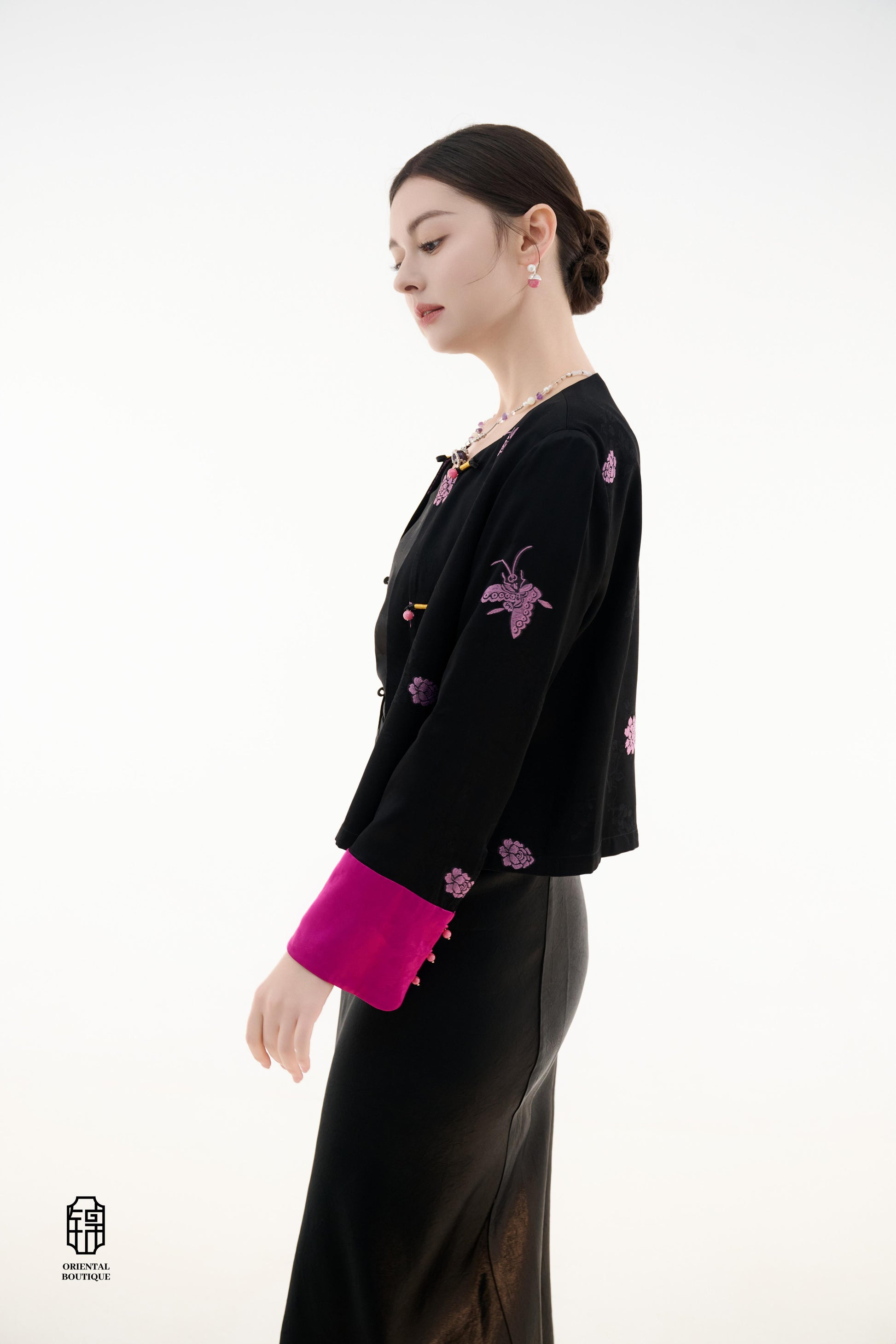 Purple Butterfly Grace Jacket,The Purple Butterfly Grace Jacket is a black outerwear piece that blends classical and modern aesthetics. Adorned with delicate purple butterfly and floral embroidery, it symbolizes elegance and romance. The unique button des