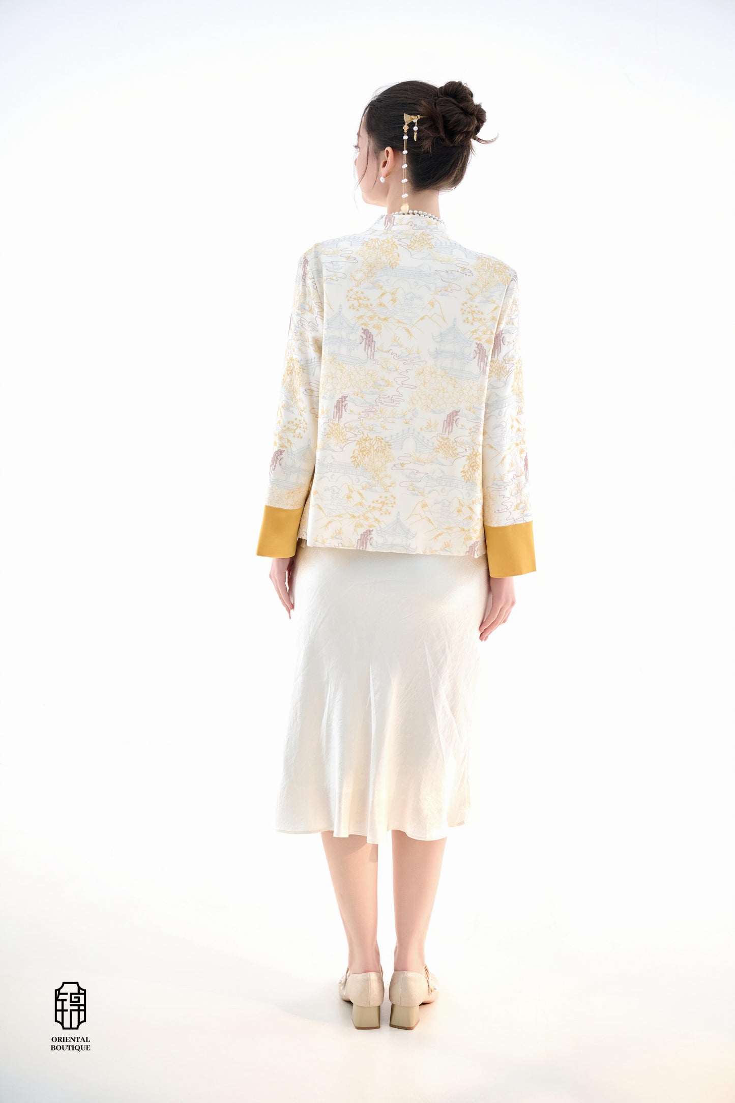 Scenic Brocade Jacket,The Scenic Brocade Jacket features intricate embroidered designs depicting traditional landscapes of mountains, pagodas, and natural scenery, showcasing an Oriental charm. With a base of soft ivory and accents of bright golden yellow