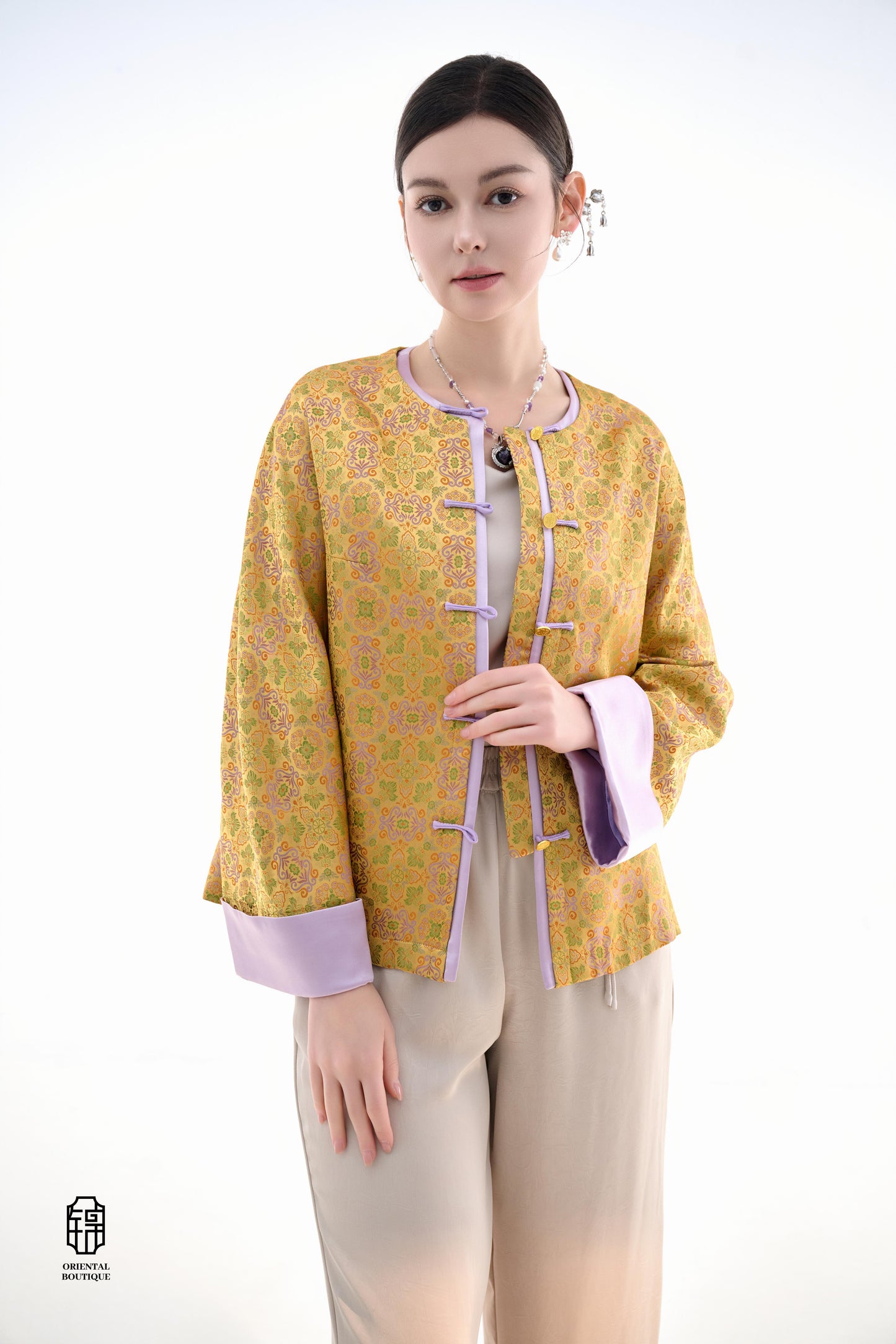 Golden Lilac Brocade Jacket,The Golden Lilac Brocade Jacket features a rich golden yellow base adorned with intricate floral patterns, embodying the timeless elegance of traditional Eastern fashion. The lilac accents on the collar, cuffs, and frog buttons