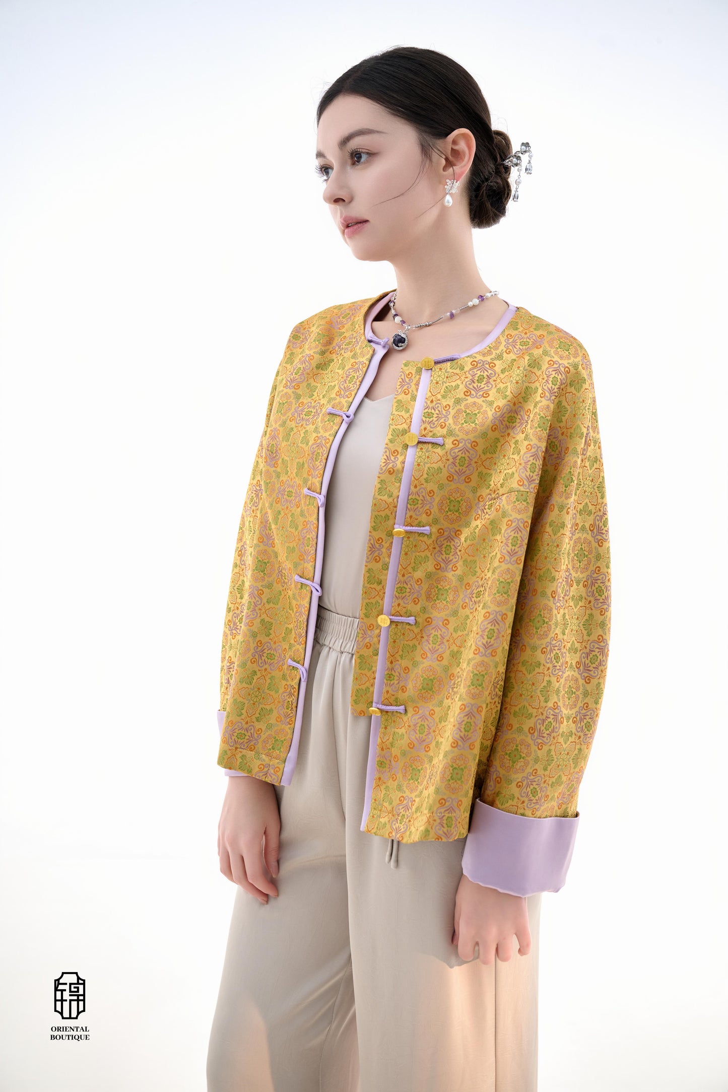 Golden Lilac Brocade Jacket,The Golden Lilac Brocade Jacket features a rich golden yellow base adorned with intricate floral patterns, embodying the timeless elegance of traditional Eastern fashion. The lilac accents on the collar, cuffs, and frog buttons