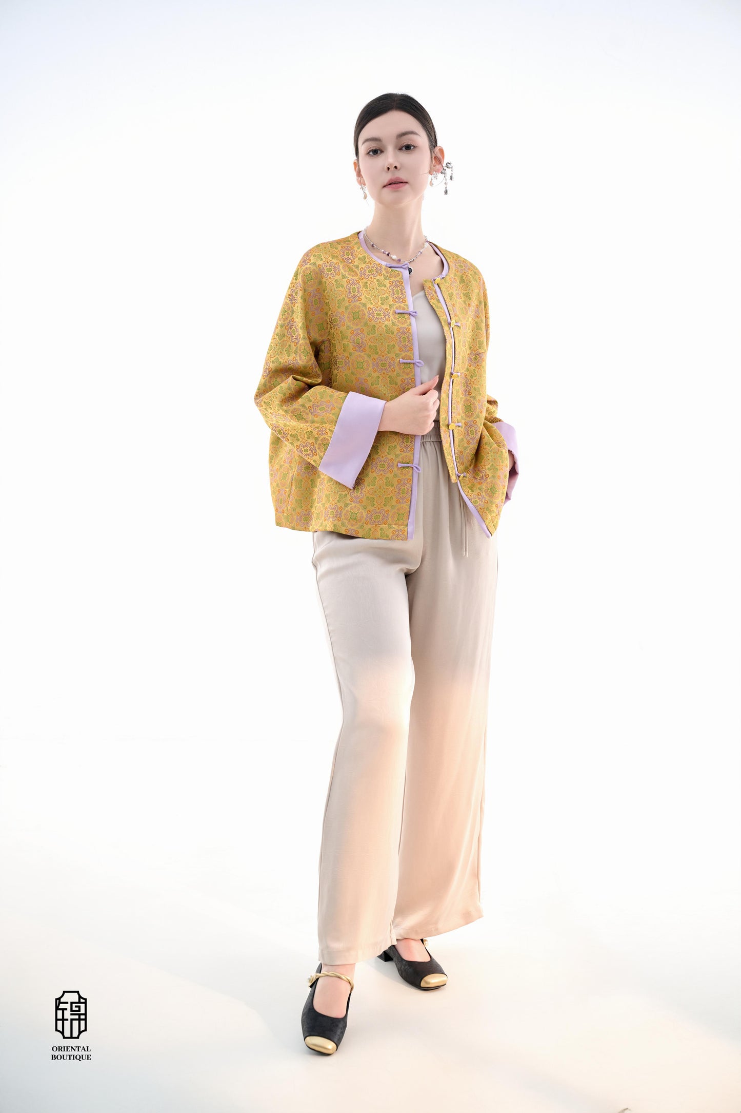 Golden Lilac Brocade Jacket,The Golden Lilac Brocade Jacket features a rich golden yellow base adorned with intricate floral patterns, embodying the timeless elegance of traditional Eastern fashion. The lilac accents on the collar, cuffs, and frog buttons
