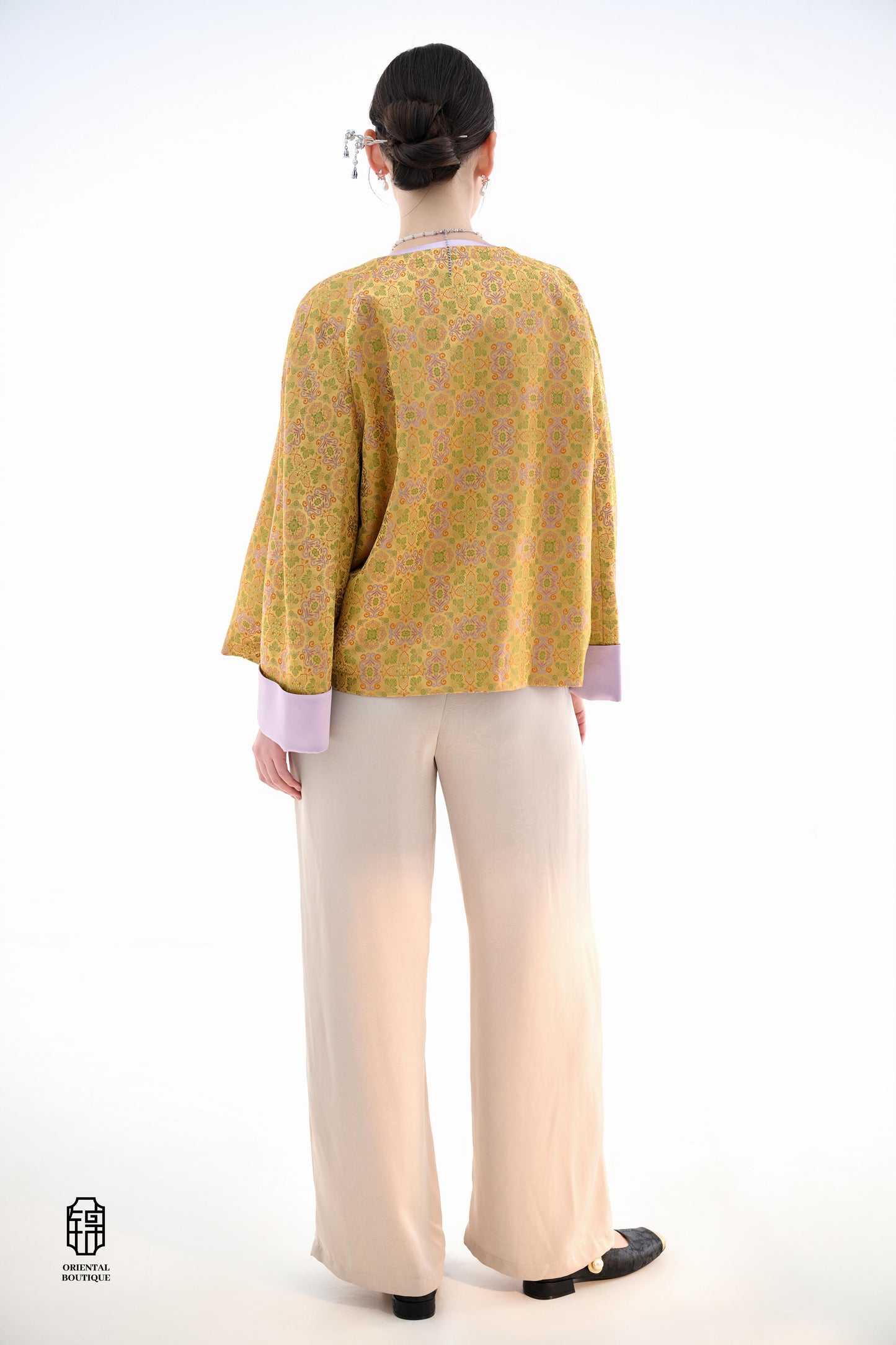 Golden Lilac Brocade Jacket,The Golden Lilac Brocade Jacket features a rich golden yellow base adorned with intricate floral patterns, embodying the timeless elegance of traditional Eastern fashion. The lilac accents on the collar, cuffs, and frog buttons