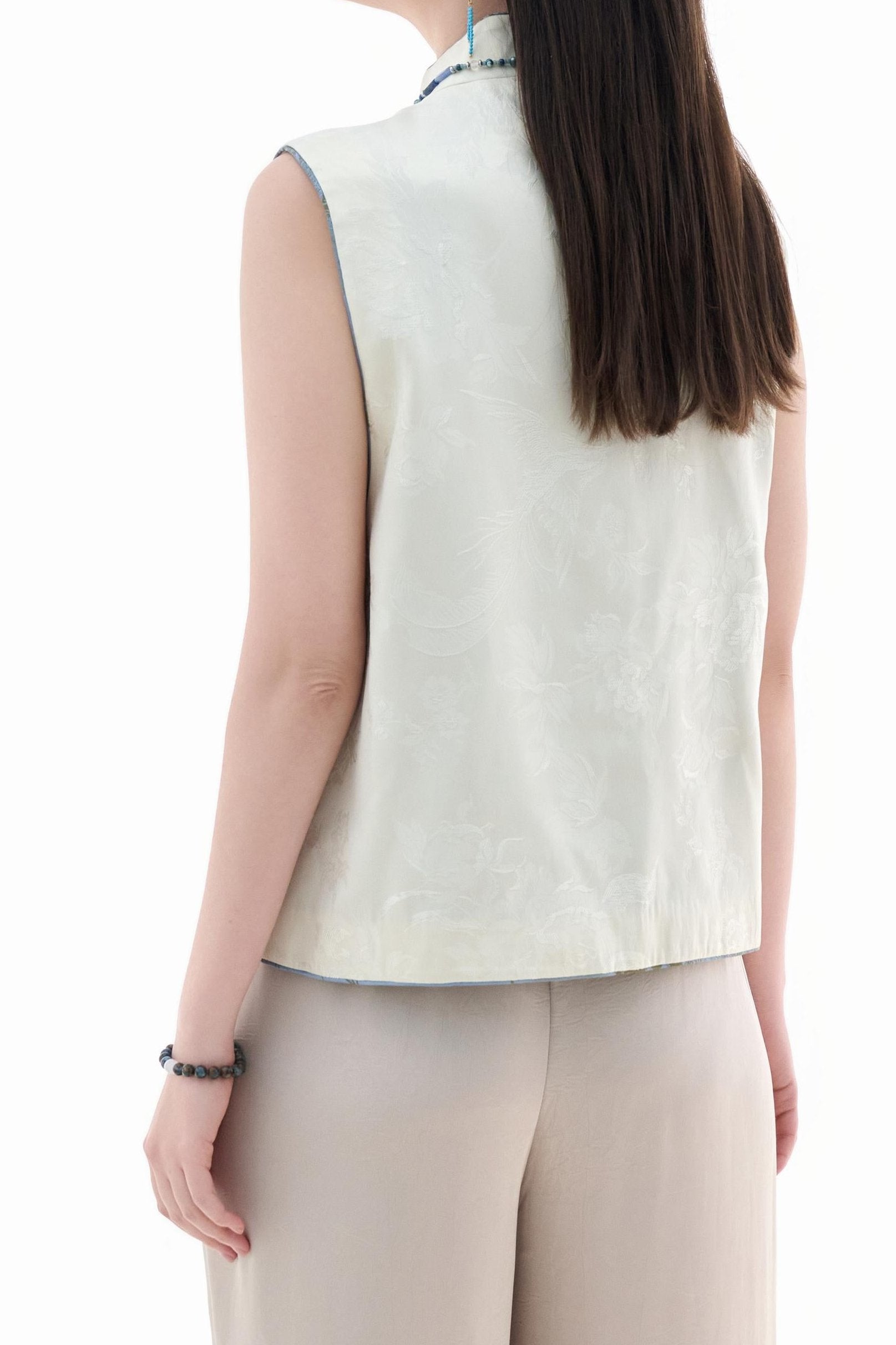 Cloud Brocade Mandarin Collar Sleeveless Vest,The Cloud Brocade Mandarin Collar Sleeveless Vest features a light brocade fabric, offering a simple and elegant look. The mandarin collar and traditional knotted buttons reflect the essence of classic Chinese