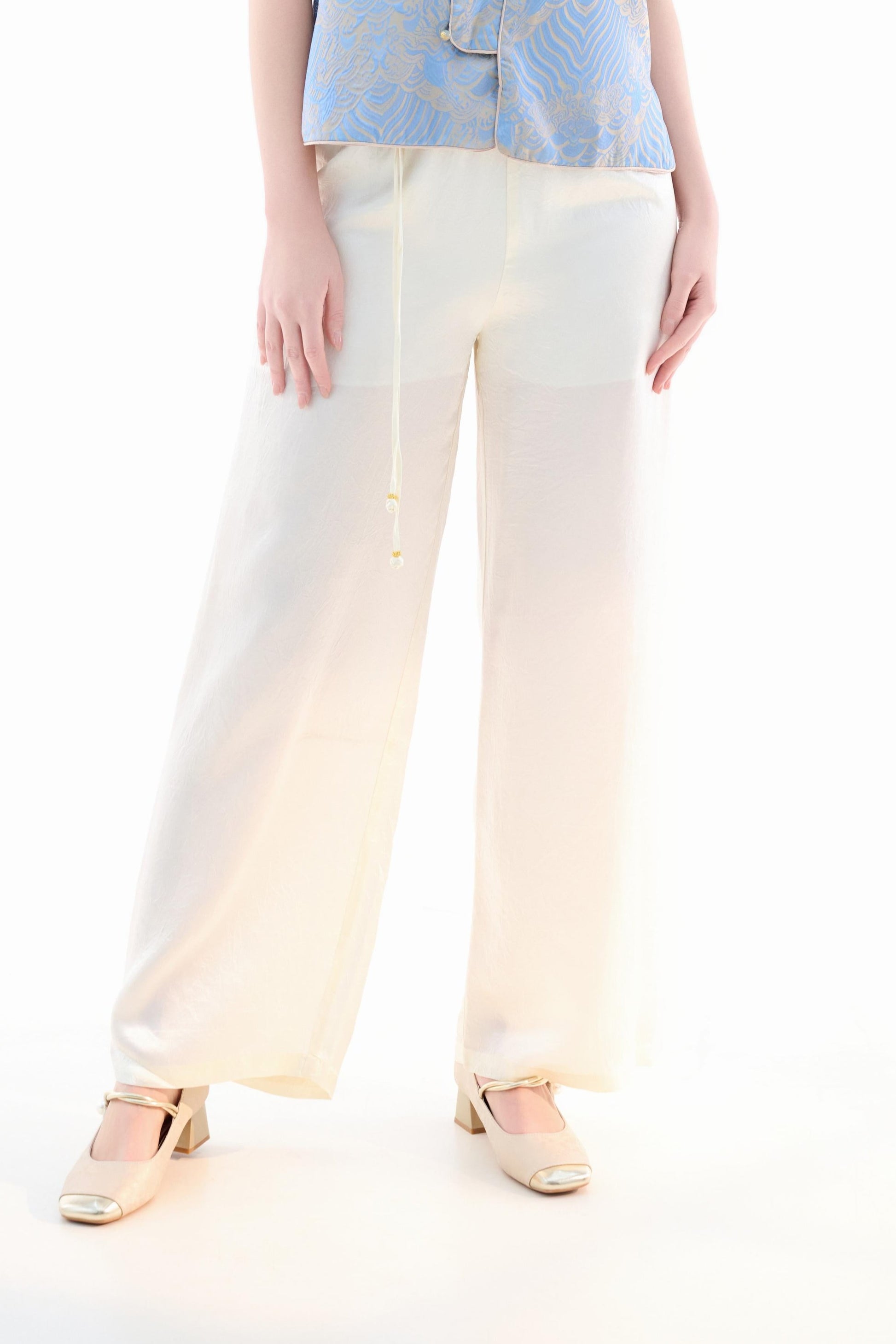 Silk Pants,These silk pants are crafted from high-quality silk fabric, offering a luxuriously smooth and delicate feel for an exceptional wearing experience. The simple design is paired with a high-waisted cut to elegantly accentuate the figure, enhancing