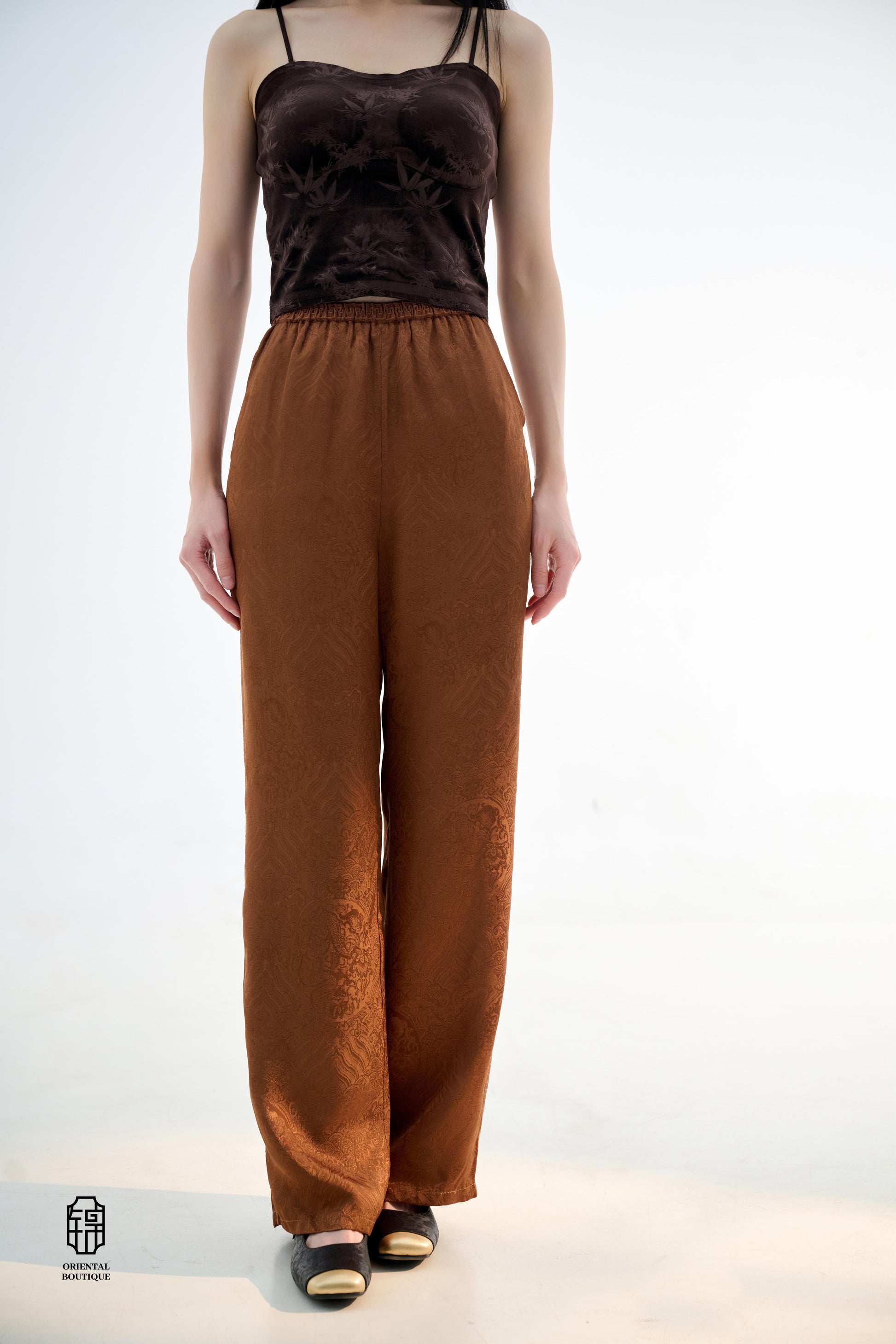 Brocade Trousers,These pants come in two elegant options: ivory and mocha. Made from refined silk fabric with intricate jacquard patterns, they add a touch of luxury to any outfit. The minimalist design and loose fit offer a comfortable wearing experience